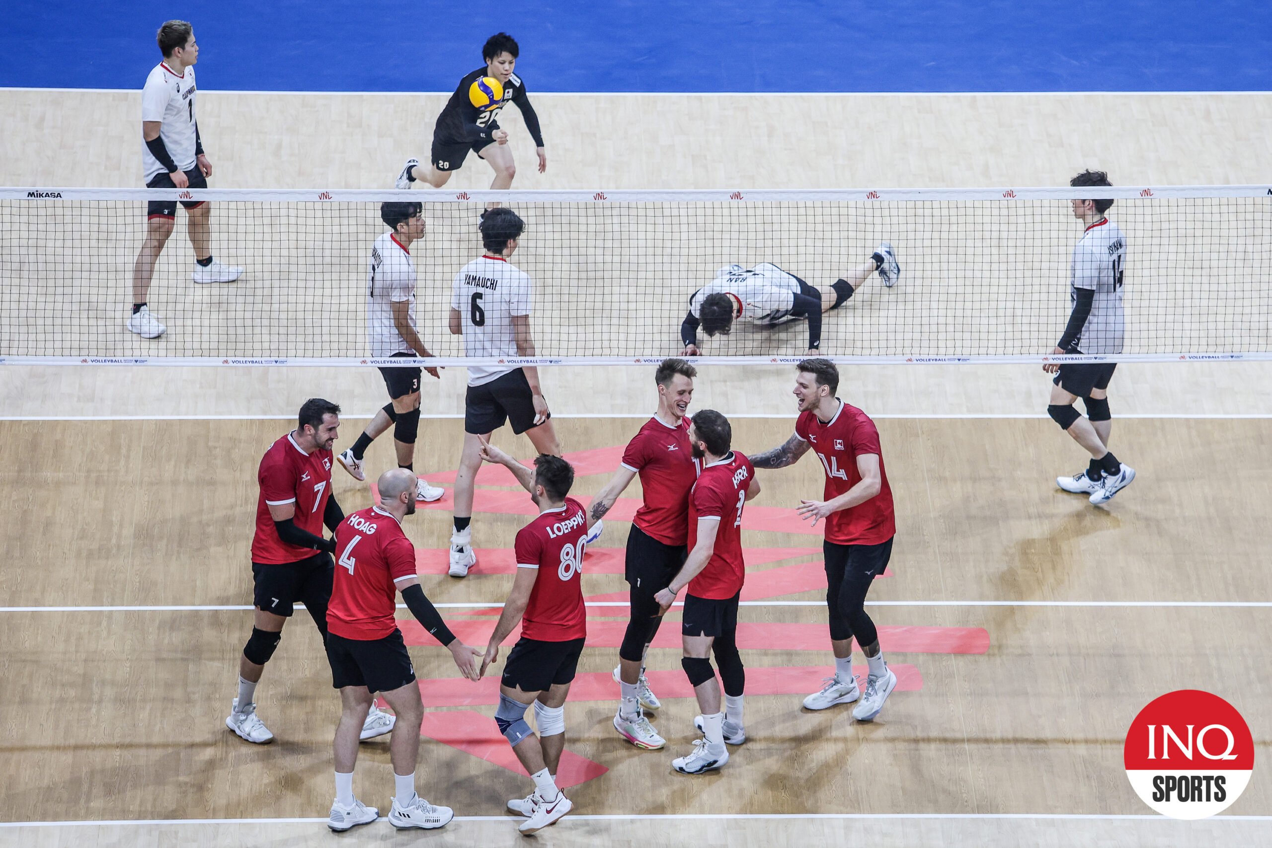 Canada celebrates a point against Japan in the VNL Week 3 match in Manila, Philippines.