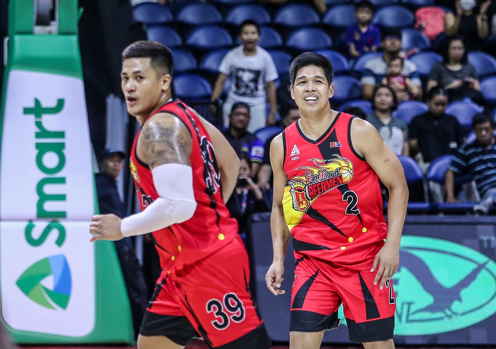 San Miguel Beermen's Don Trollano and Jericho Cruz during a PBA game.