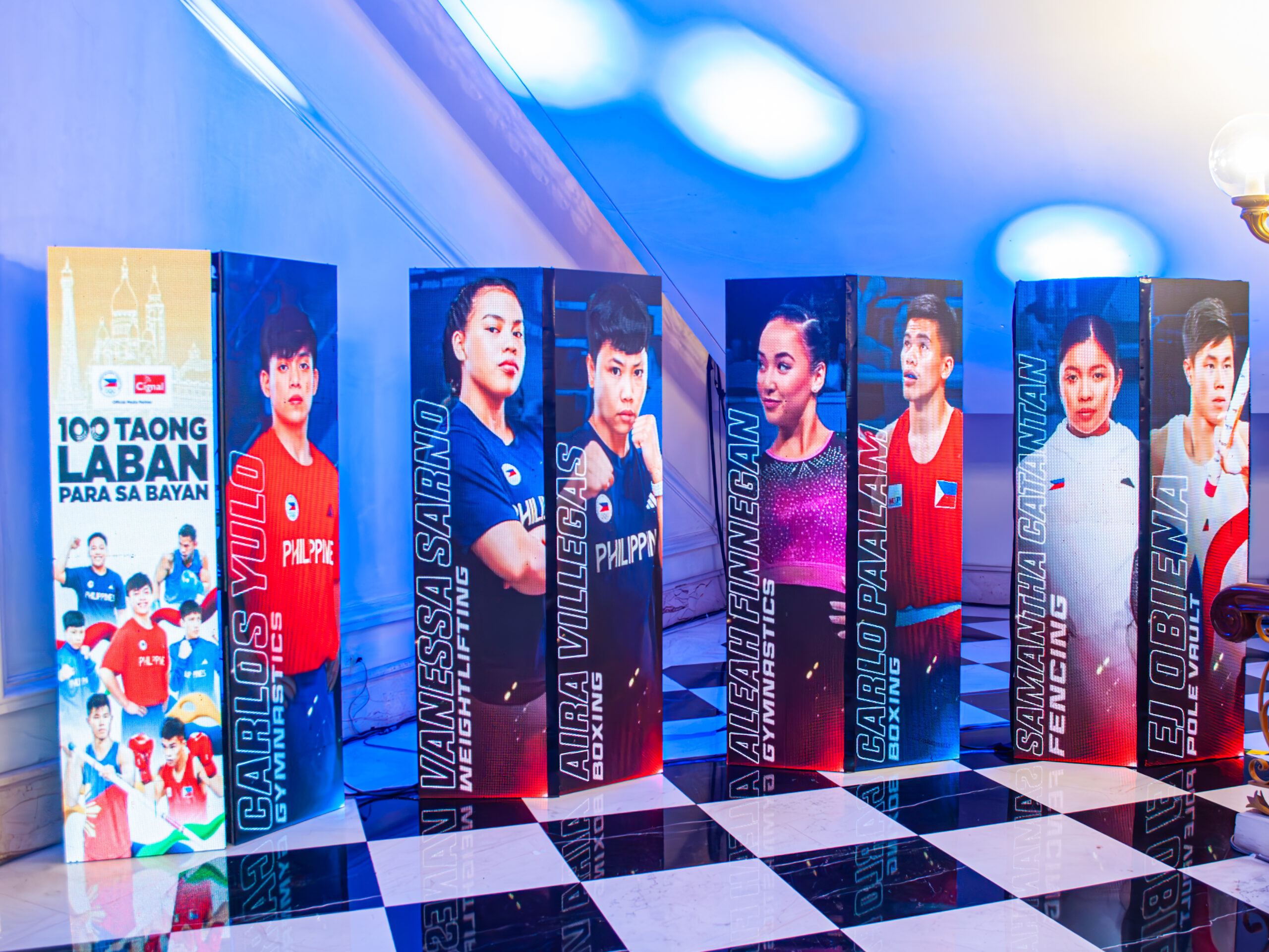 Photos of the Philippine bets for the Paris Olympics 2024 on display during the Olympics send off hosted by POC and Cignal, the official broadcast partner for the Summer Games.