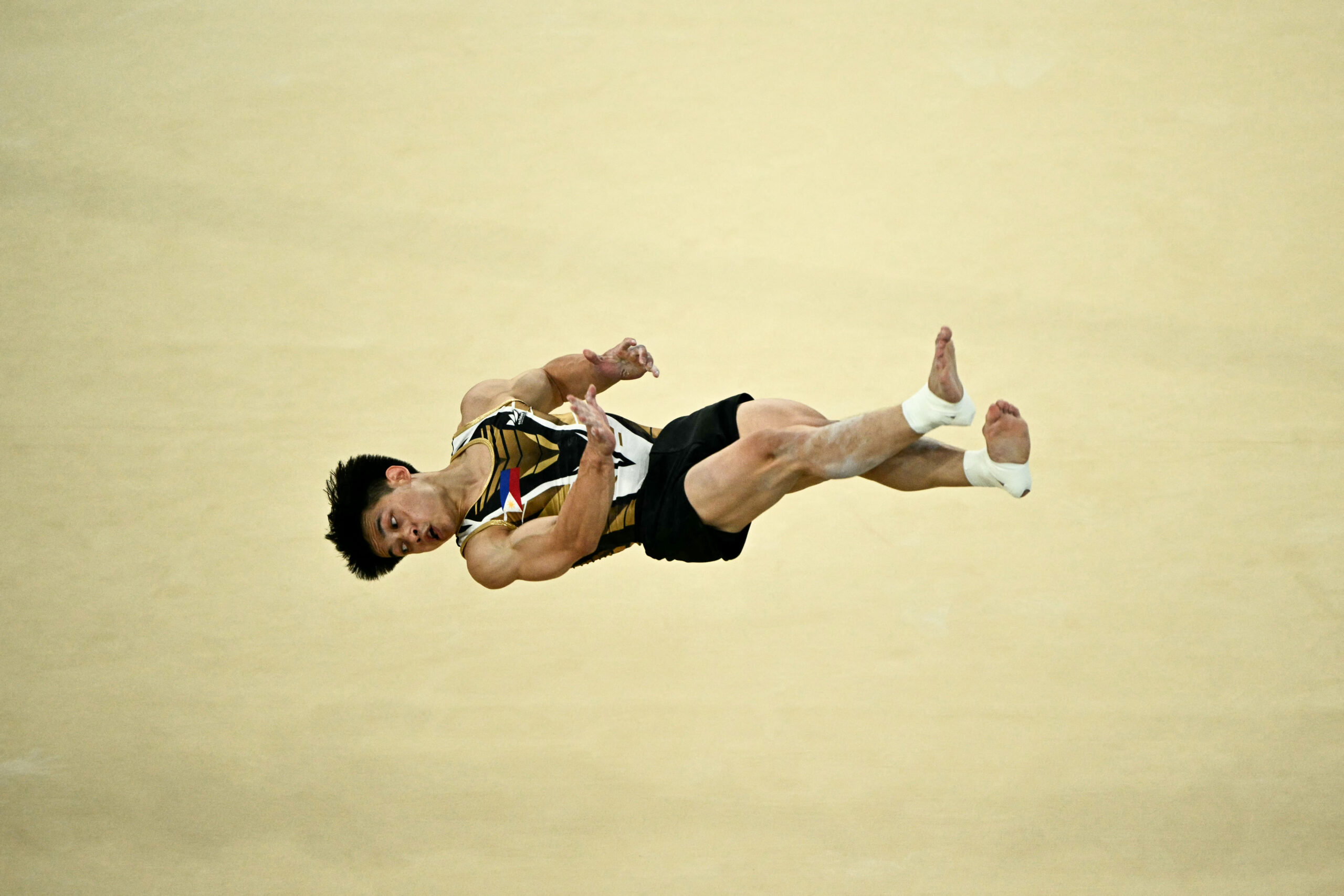 Philippines' Carlos Edriel Yulo competes in the floor event of the artistic gymnastics men's all-around final during the Paris 2024 Olympic Games at the Bercy Arena in Paris, on July 31, 2024. 