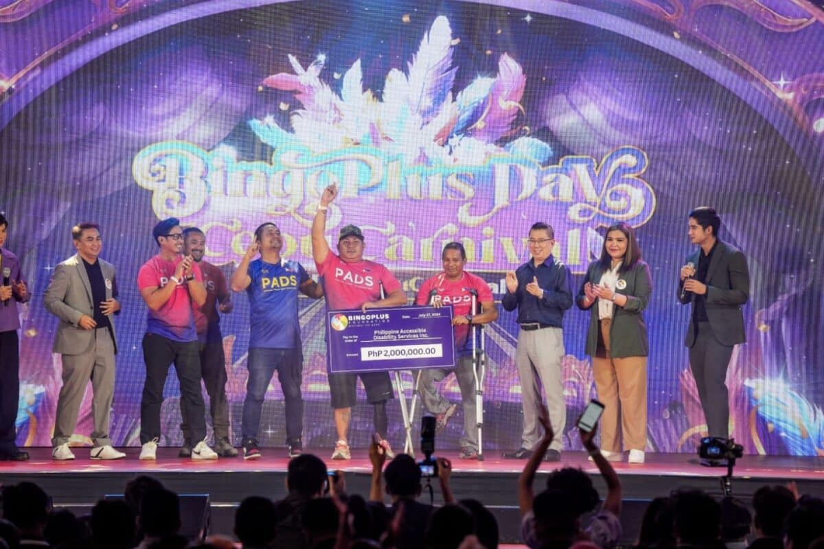 President Andy Tsui, President Jasper Vicencio, and Vice President Celeste Jovenir cheering alongside the representatives of PADS as they receive their cheque donation.