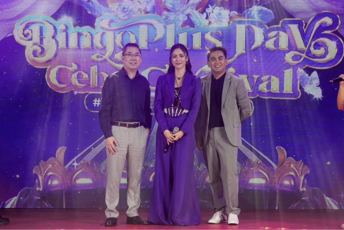 President Andy Tsui and President Jasper Vicencio posing with Kim Chiu, BingoPlus’ newest brand endorser.