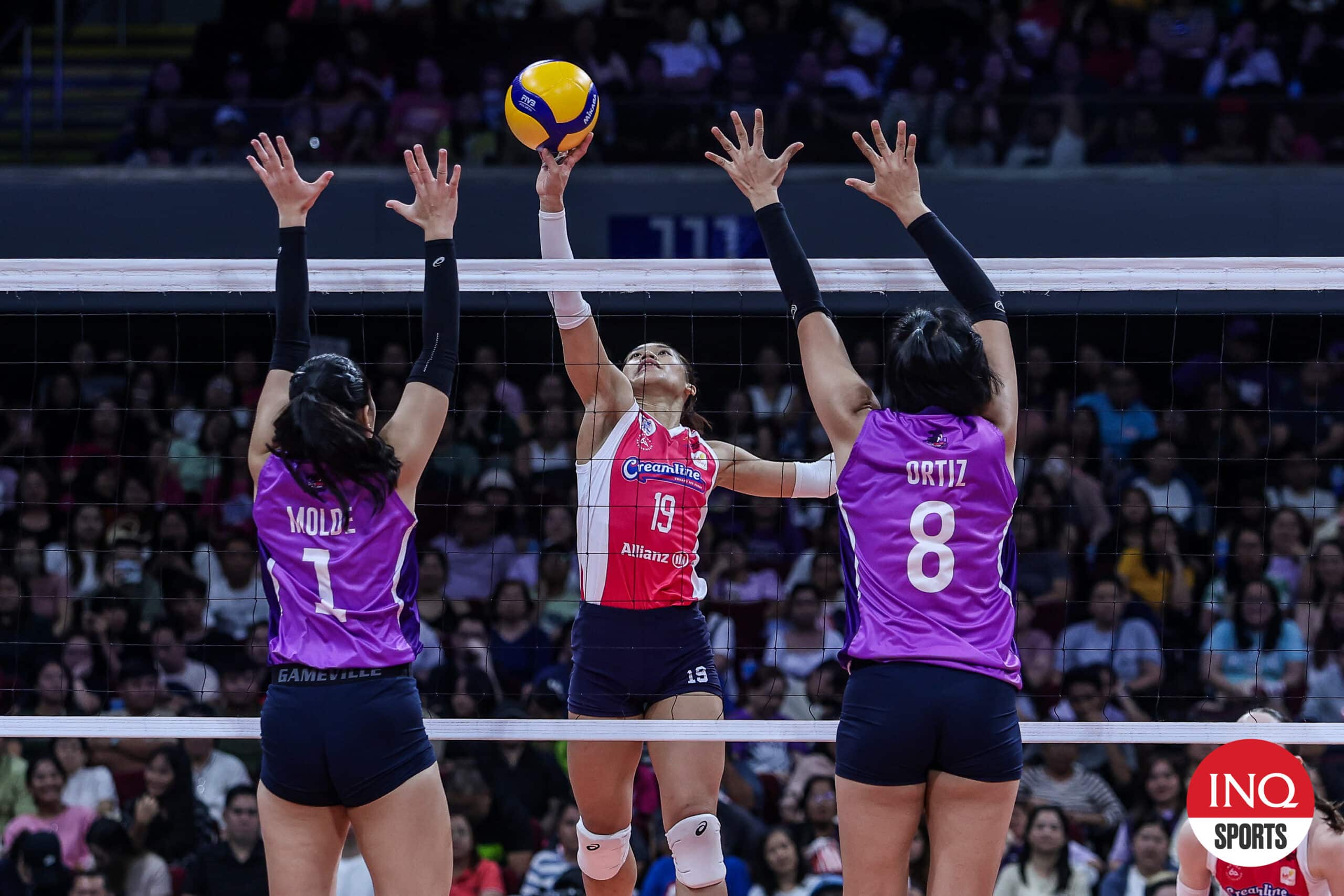 Creamline Cool Smashers' Bernadeth Pons against Choco Mucho Flying Titans defenders