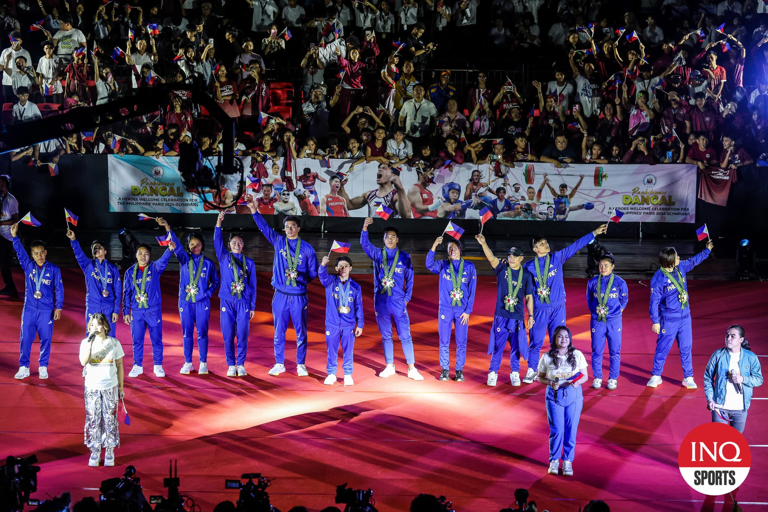 Filipino Olympians receive a warm welcome from fans after the Heroes Parade on August 14 following their Paris Olympics campaign