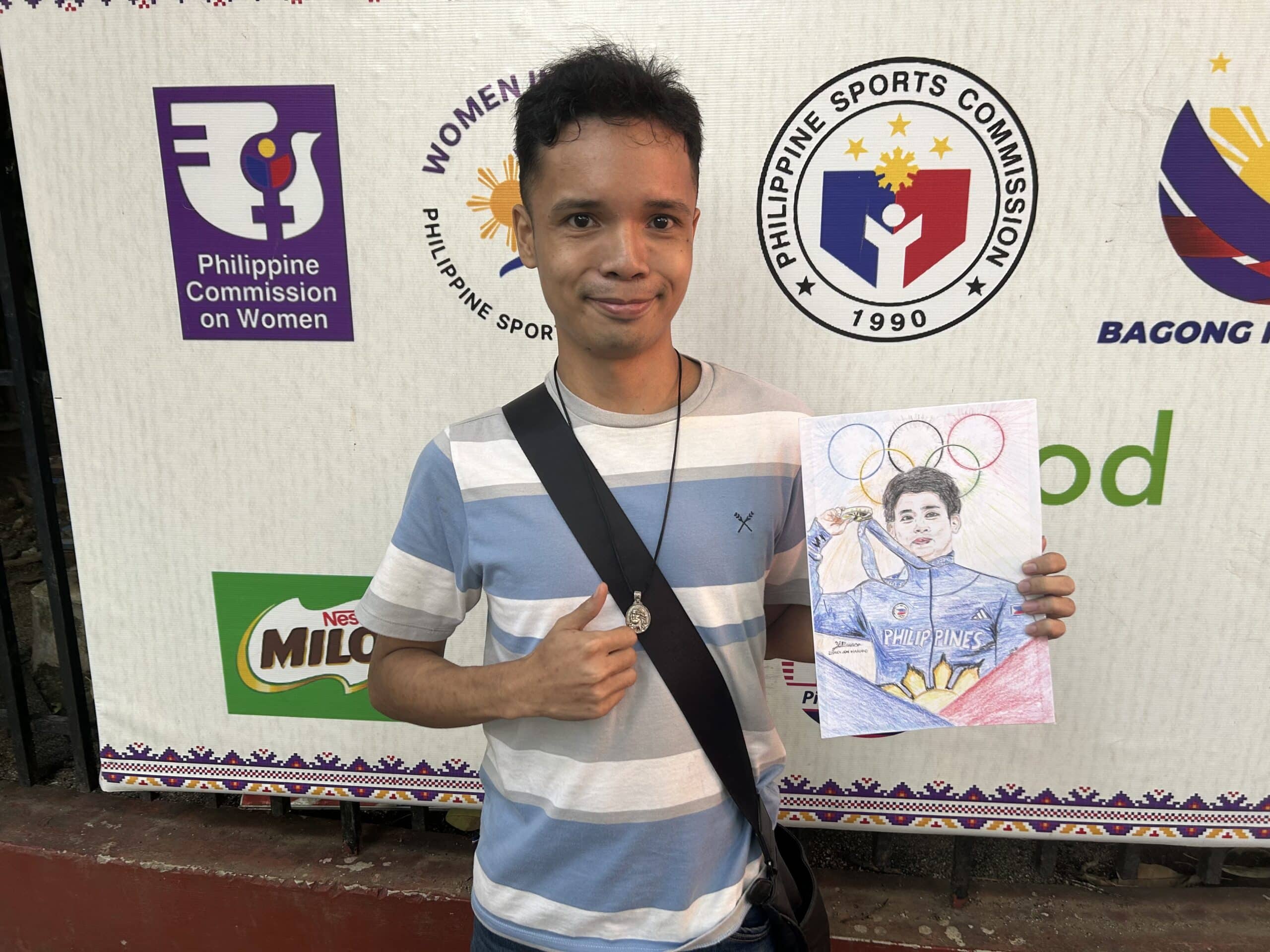 Zedrick Jon Mariano shows off his art dedicated to Paris Olympics' double gold medalist Carlos Yulo.