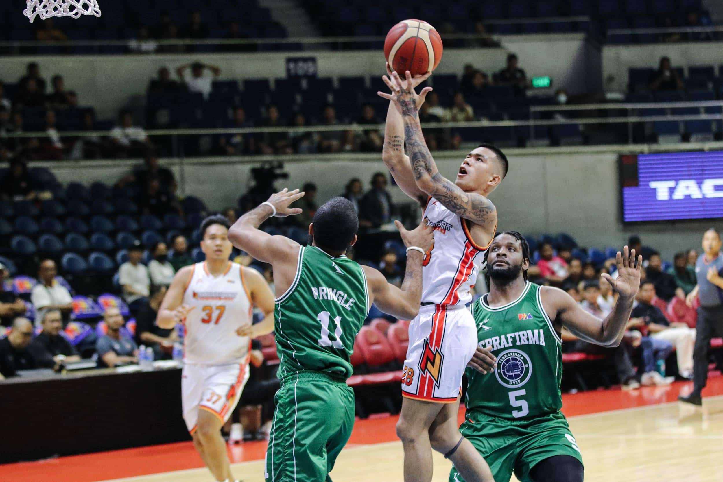 Northport's Jio Jalalon against Terrafirma's  Stanley Pringle during a PBA Governors' Cup Manila Clasico