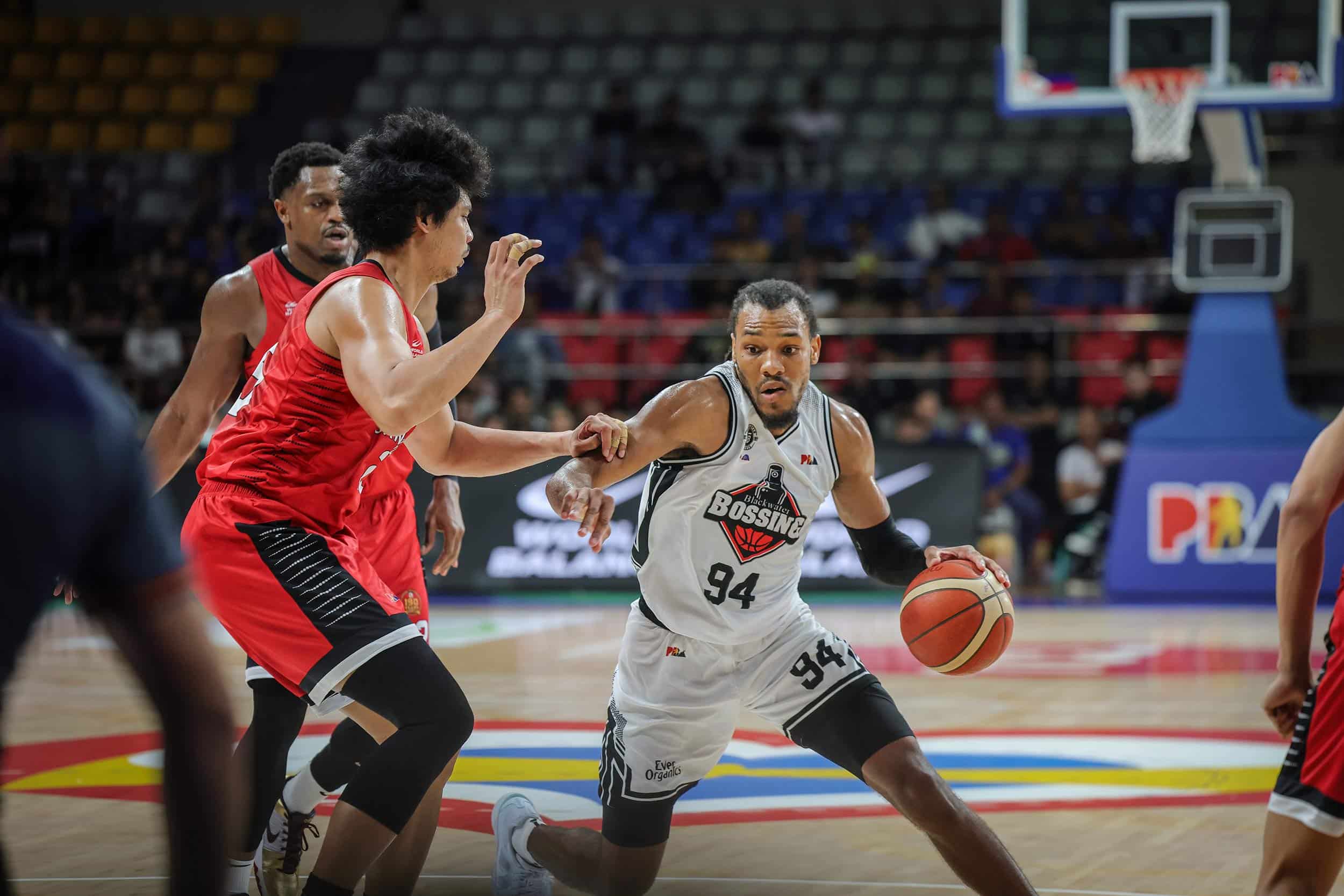 Blackwater Bossing import George King against Ginebra Gin Kings' Japeth Aguilar in a PBA Governors' Cup game.