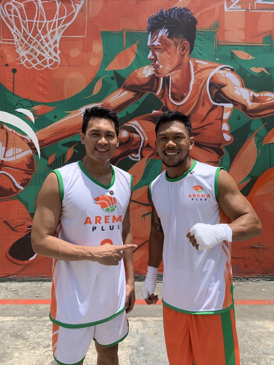 Scottie Thompson and Eumir Marcial posing together for a behind the scenes shot.