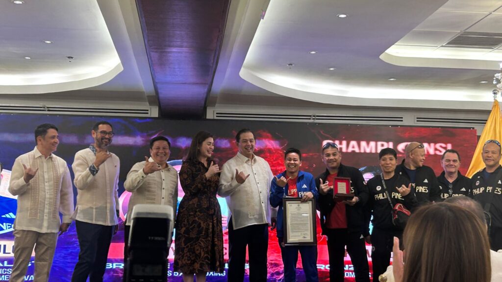 Paris Olympic medalists Carlos Yulo, Nesthy Petecio, and Aira Villegas pose for photos with lawmakers during the Congressional Reception for the Philippine delegation.