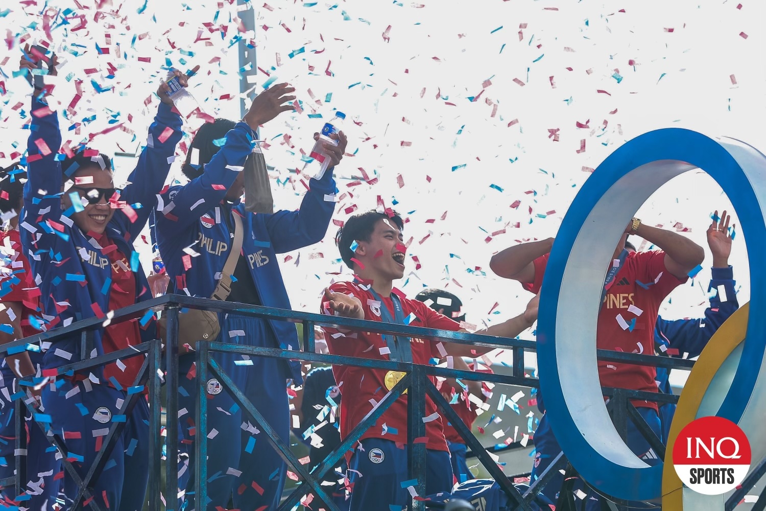 Carlos Yulo waves to the crowd during the Heroes parade after the Team Philippines' arrival from the Paris Olympics 2024