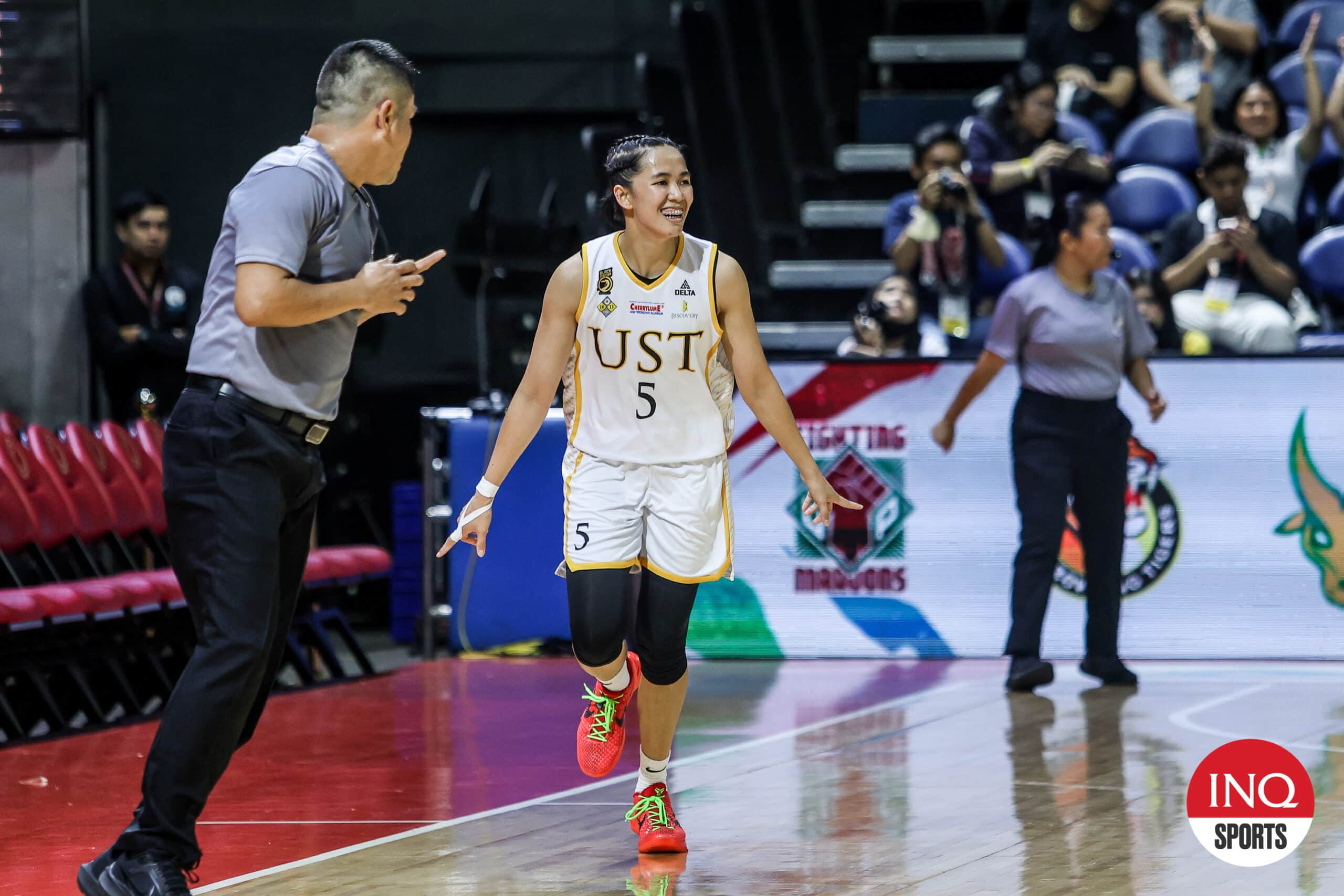 UST Tigresses' Kent Pastrana in a UAAP Season 87 women's basketball game against Ateneo