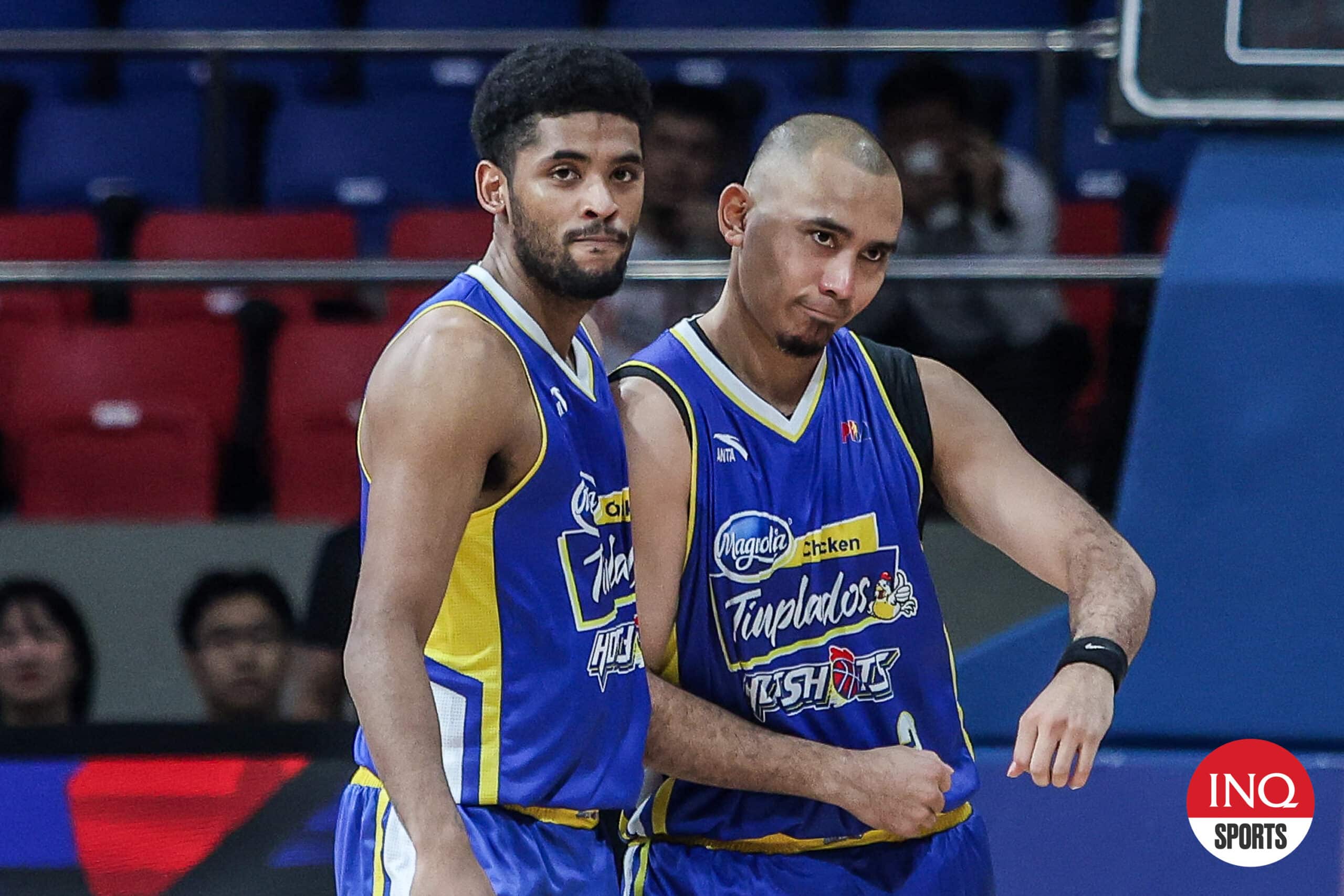 Jerrick Ahanmisi and Paul Lee of Magnolia Hotshots