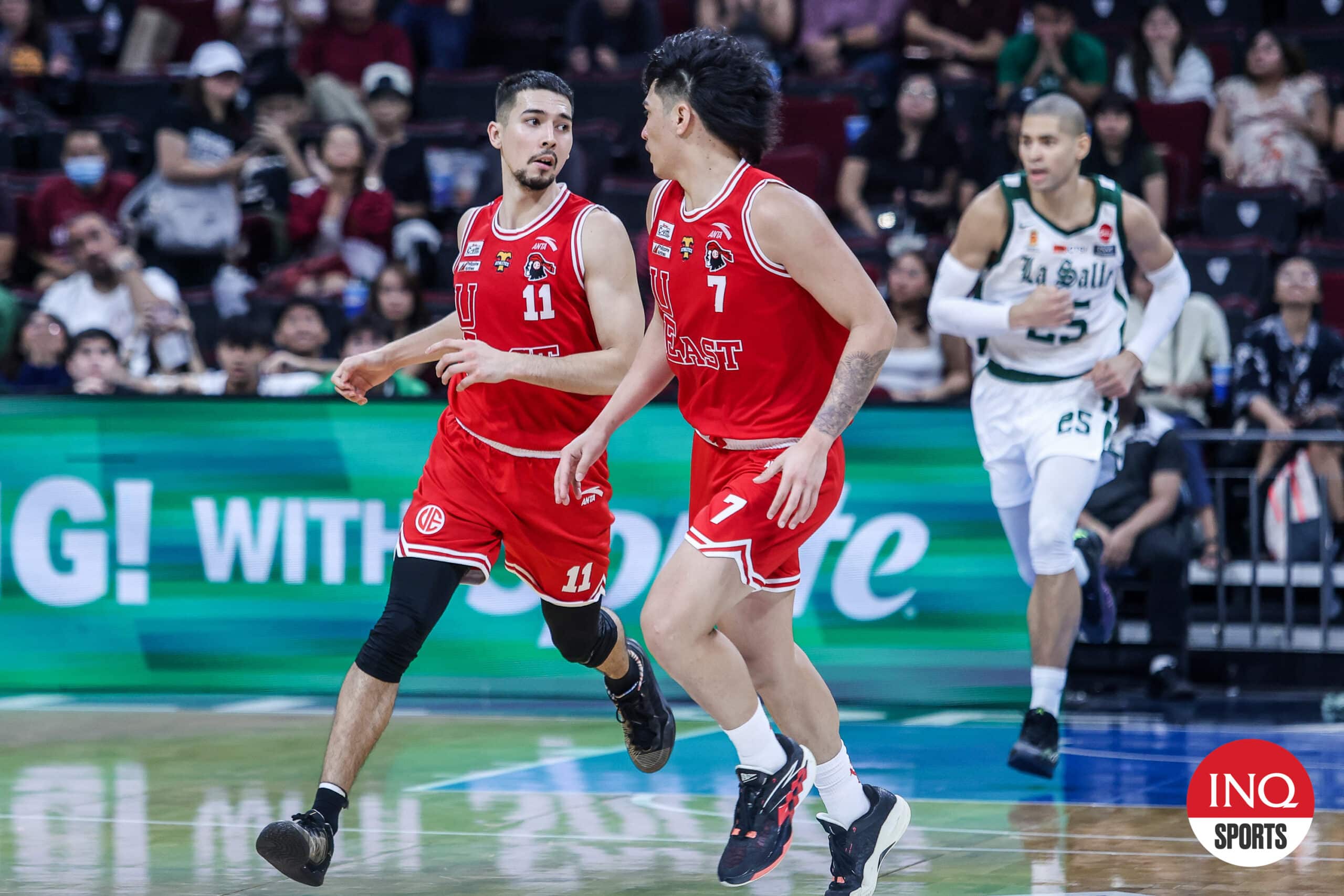 UE Red Warriors' John Abates and Wello Lingolingo during a game against the La Salle Green Archers in the UAAP Season 87 men's basketball tournament.