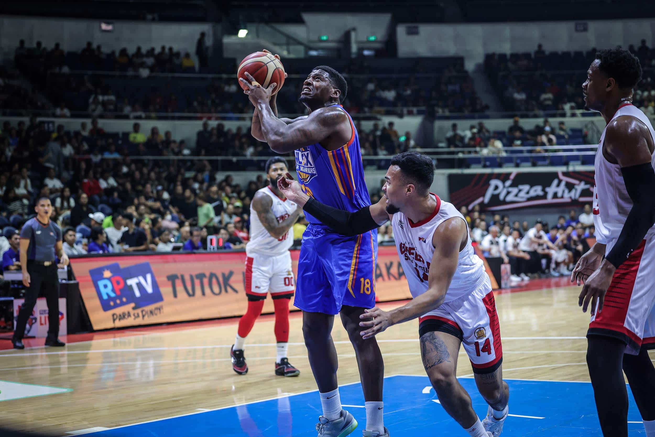 NLEX Road Warriors' DeQuan Jones against Barangay Ginebra Gin Kings' Stephen Holt during a PBA Governors' Cup game.