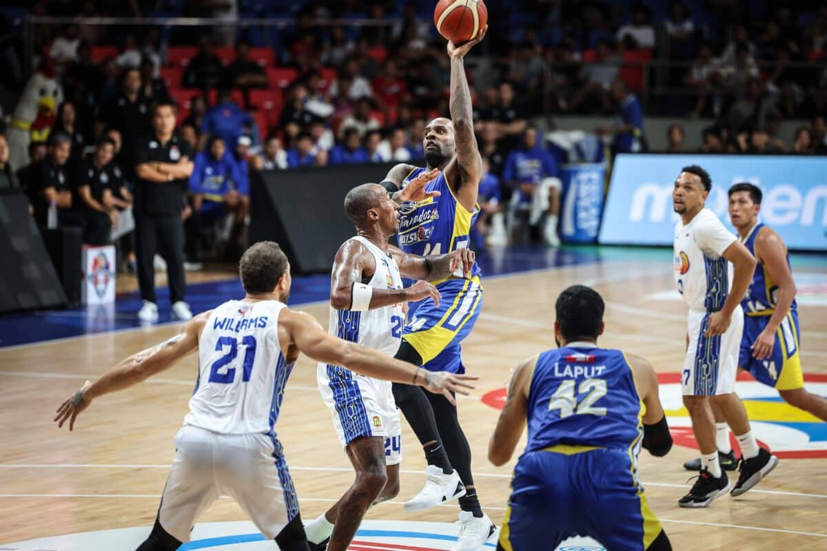 Shabazz Muhammad (with ball) was playing virtually on one leg in Magnolia’s defeat to TNT PBA