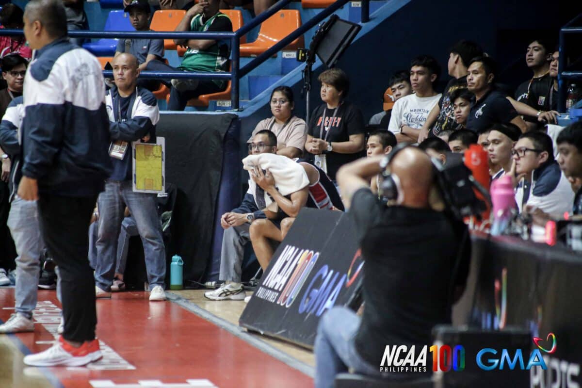 Letran's Sherick Estrada is emotional after being expelled from the NCAA