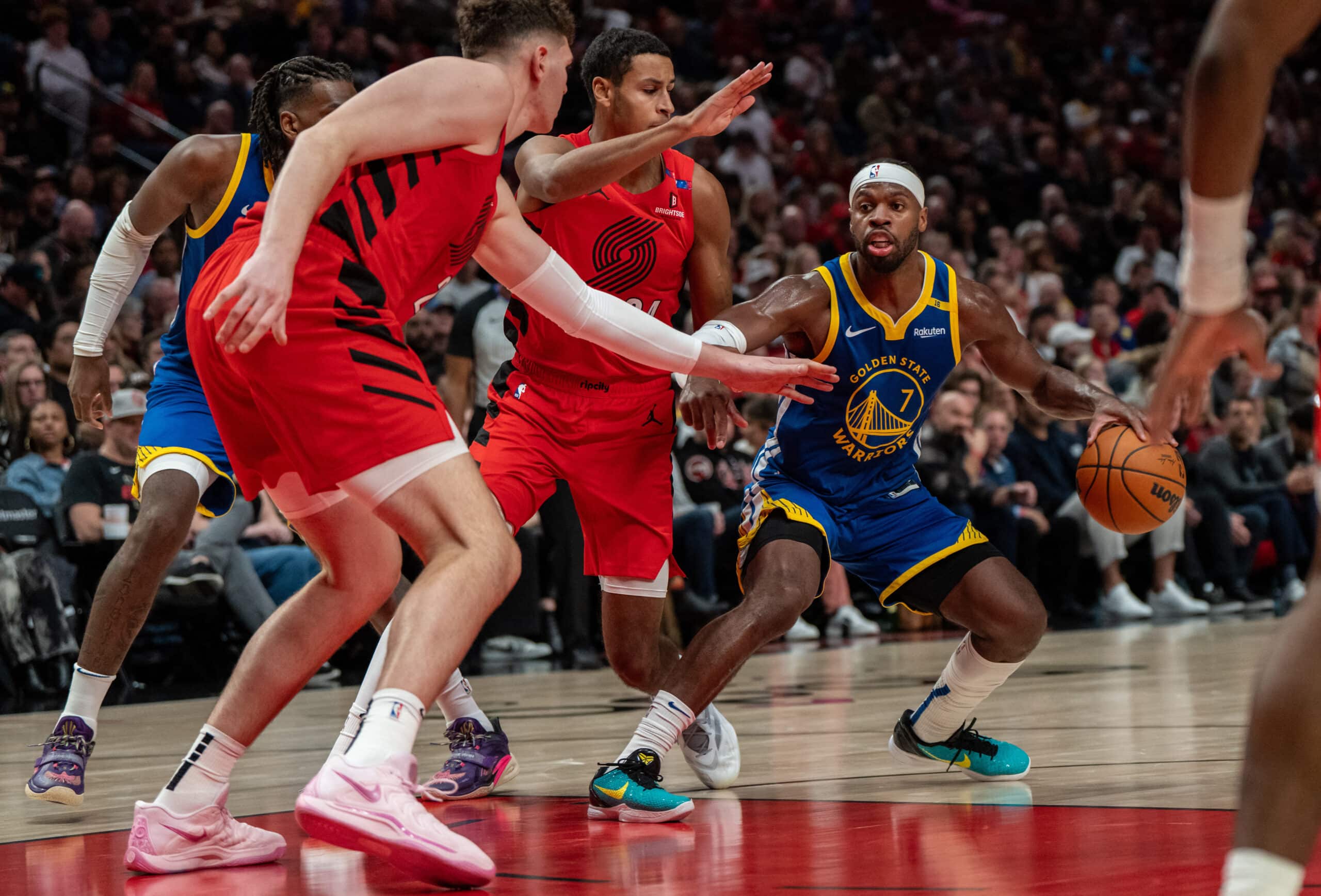 Golden State Warriors shooting guard Buddy Hield (7) dribbles the ball against Portland Trailblazers NBA scores