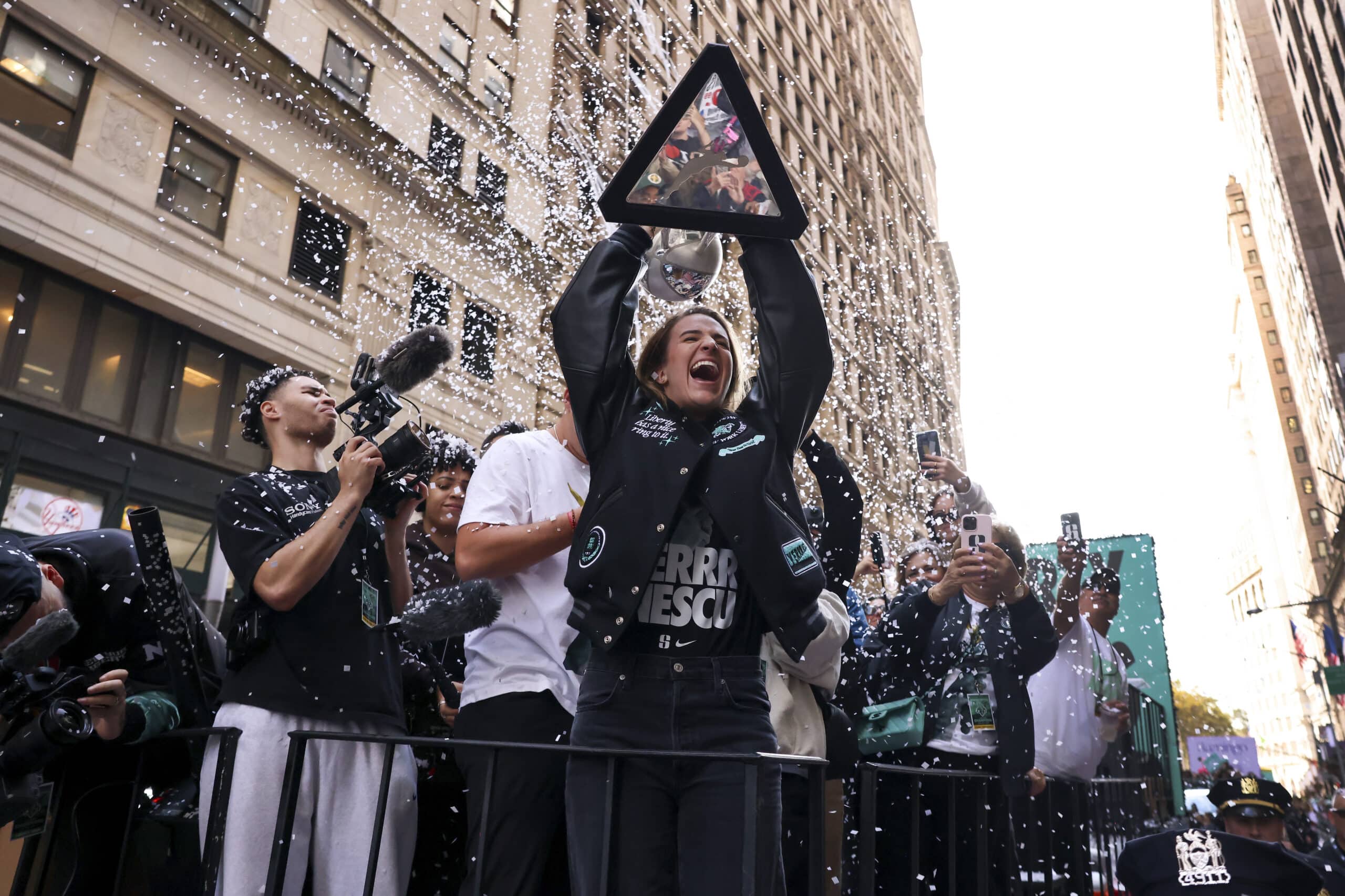 New York Liberty guard Sabrina Ionescu holds up the WNBA