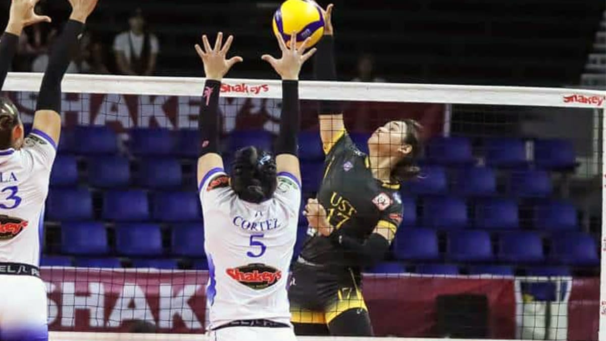 Angge Poyos (right) powers a kill past Shaine Cortez. —CONTRIBUTED PHOTO