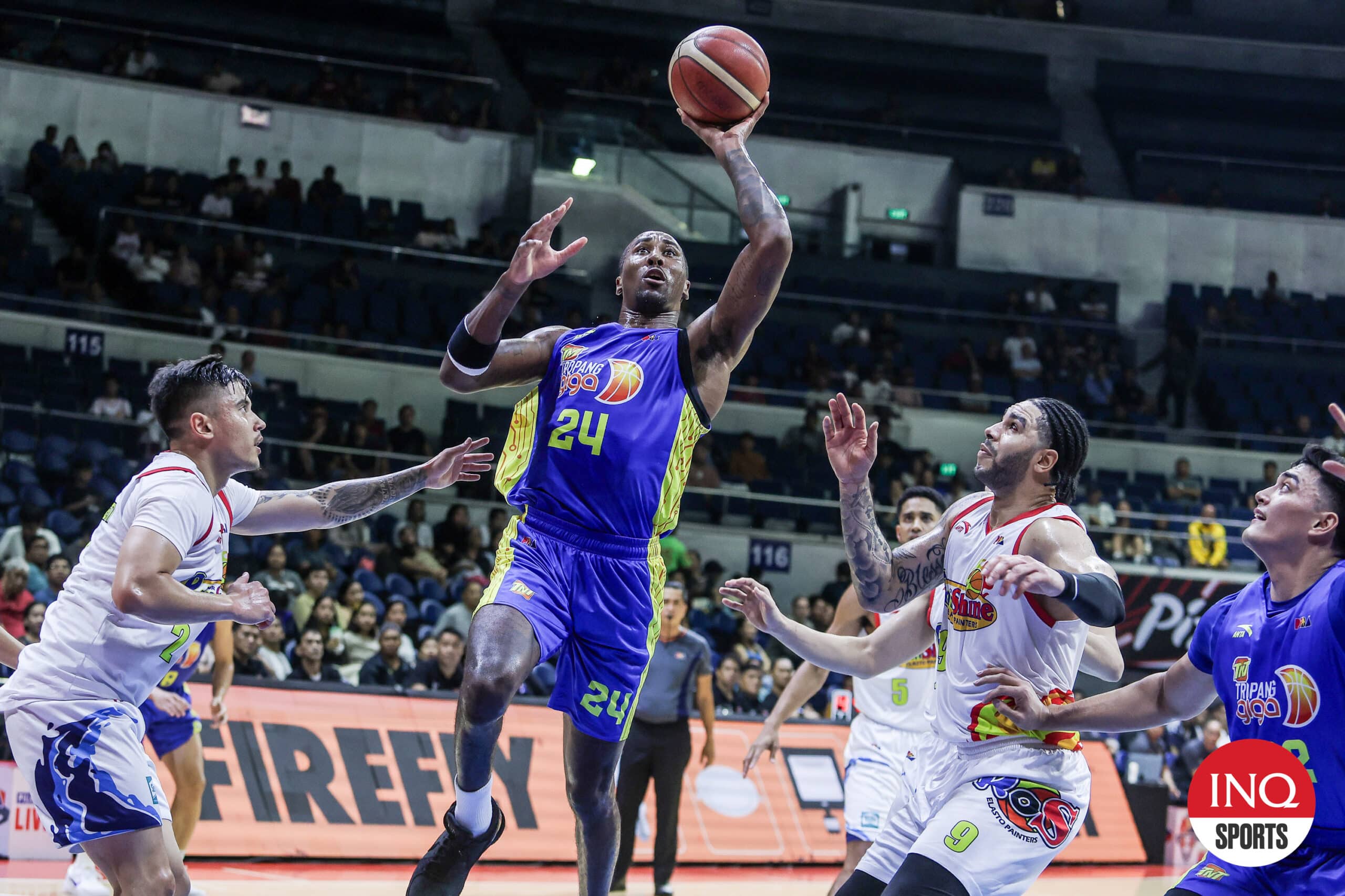 TNT import Rondae Hollis Jefferson against Rain or Shine defenders during the PBA Governors' Cup semifinals.