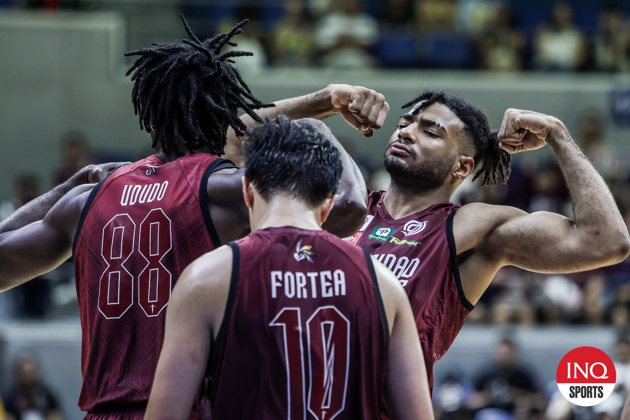 Francis Lopez and UP Fighting Maroons celebrate a point against UST Growling Tigers in the UAAP Season 87 men's basketball tournament.