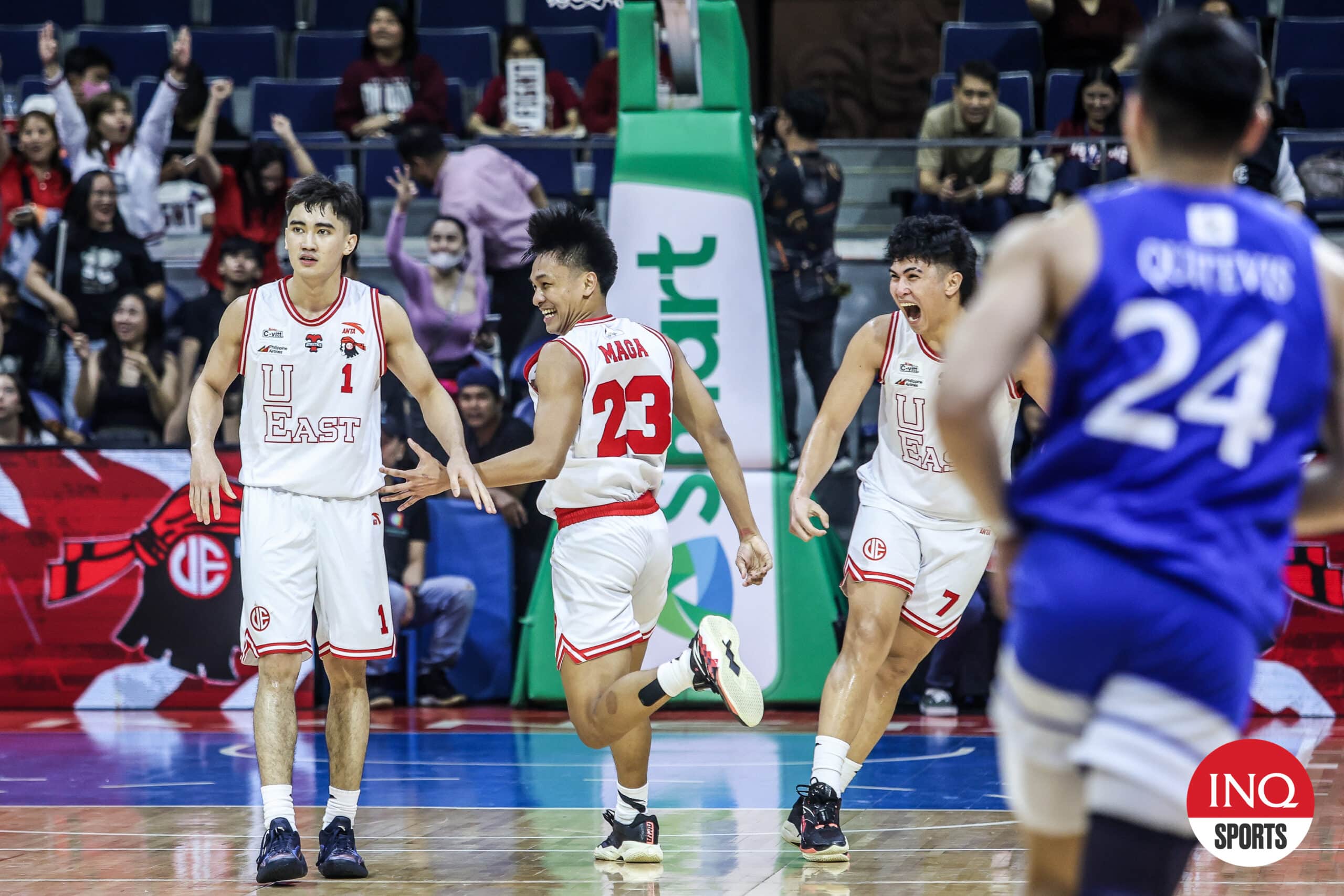 UE Red Warriors' Nico Mulingtapang, Rainer Maga and Wello Lingolingo during a UAAP Season 87 men's basketball game against Ateneo Blue Eagles.