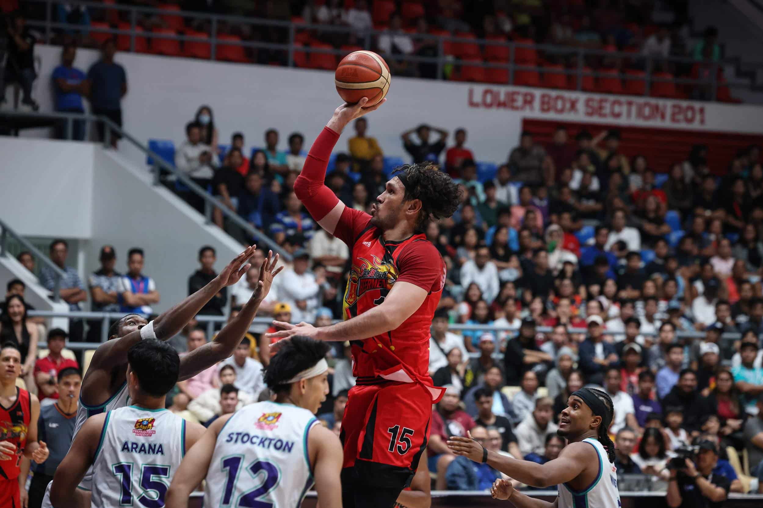 San Miguel Beermen's June Mar Fajardo with a teardrop shot over Converge defenders during the PBA Governors' Cup quarterfinals.