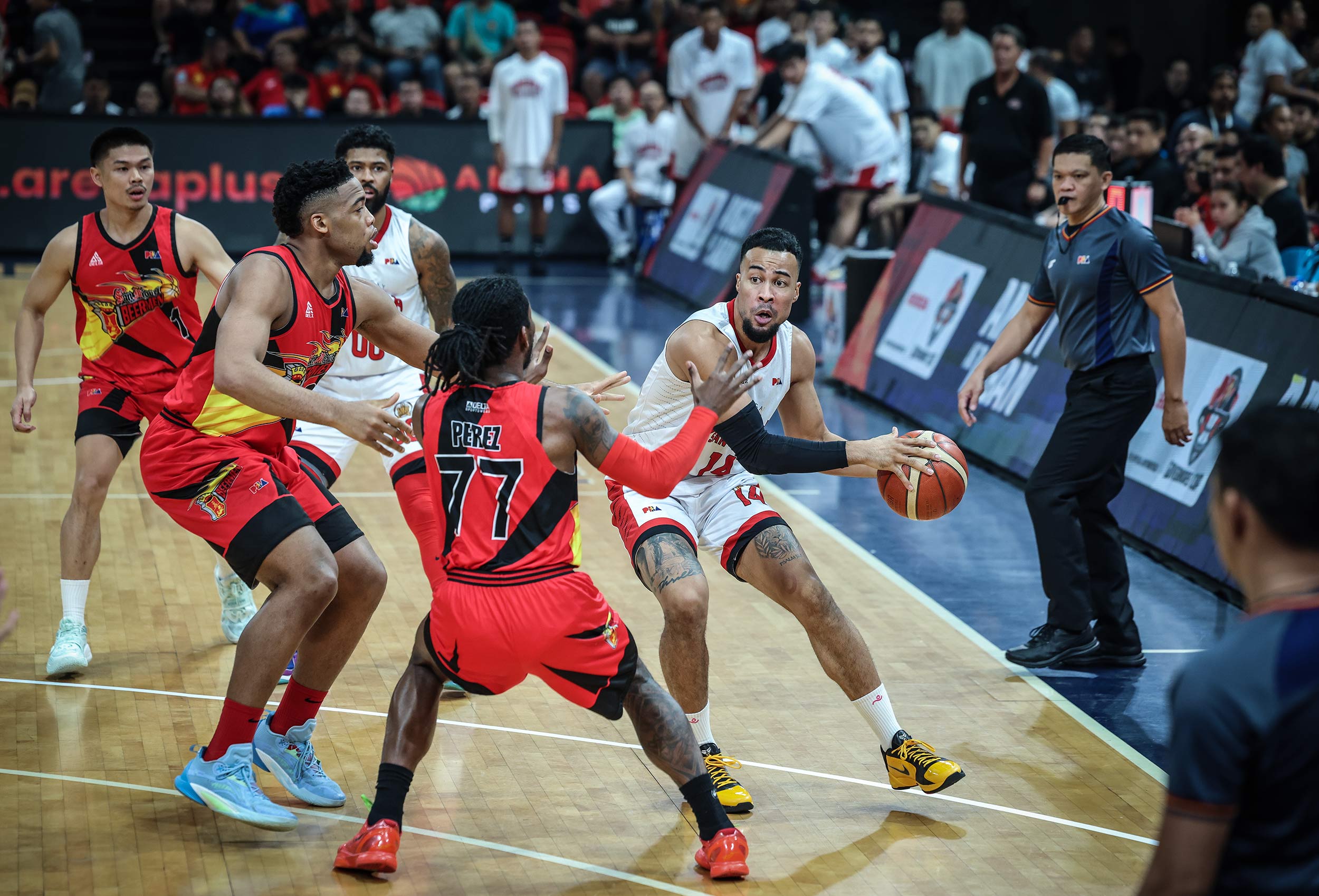 Barangay Ginebra Gin Kings' Stephen Holt against San Miguel Beermen defenders during Game 1 of the PBA Governors' Cup semifinals. 