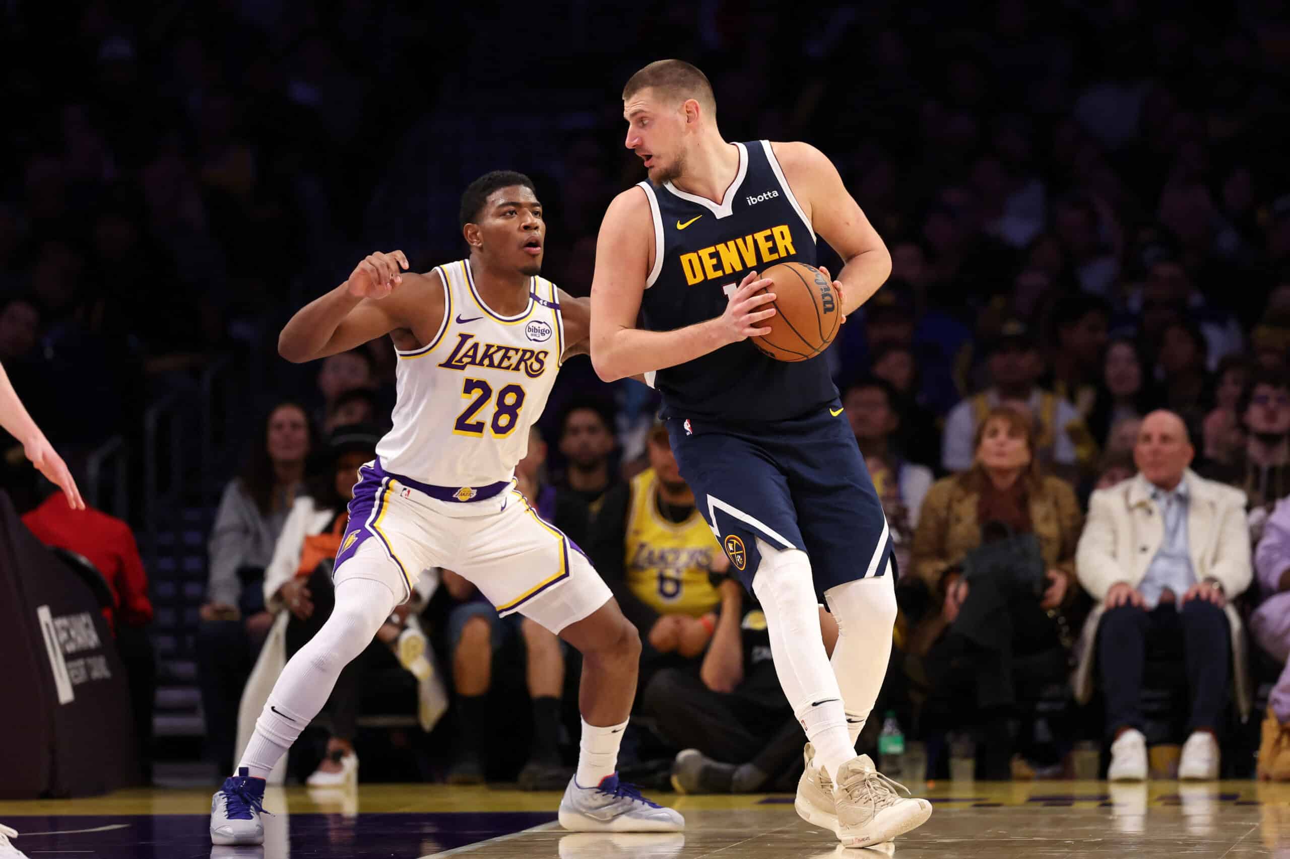 ;  Denver Nuggets center Nikola Jokic (15) posts up against Los Angeles Lakers forward Rui Hachimura NBA