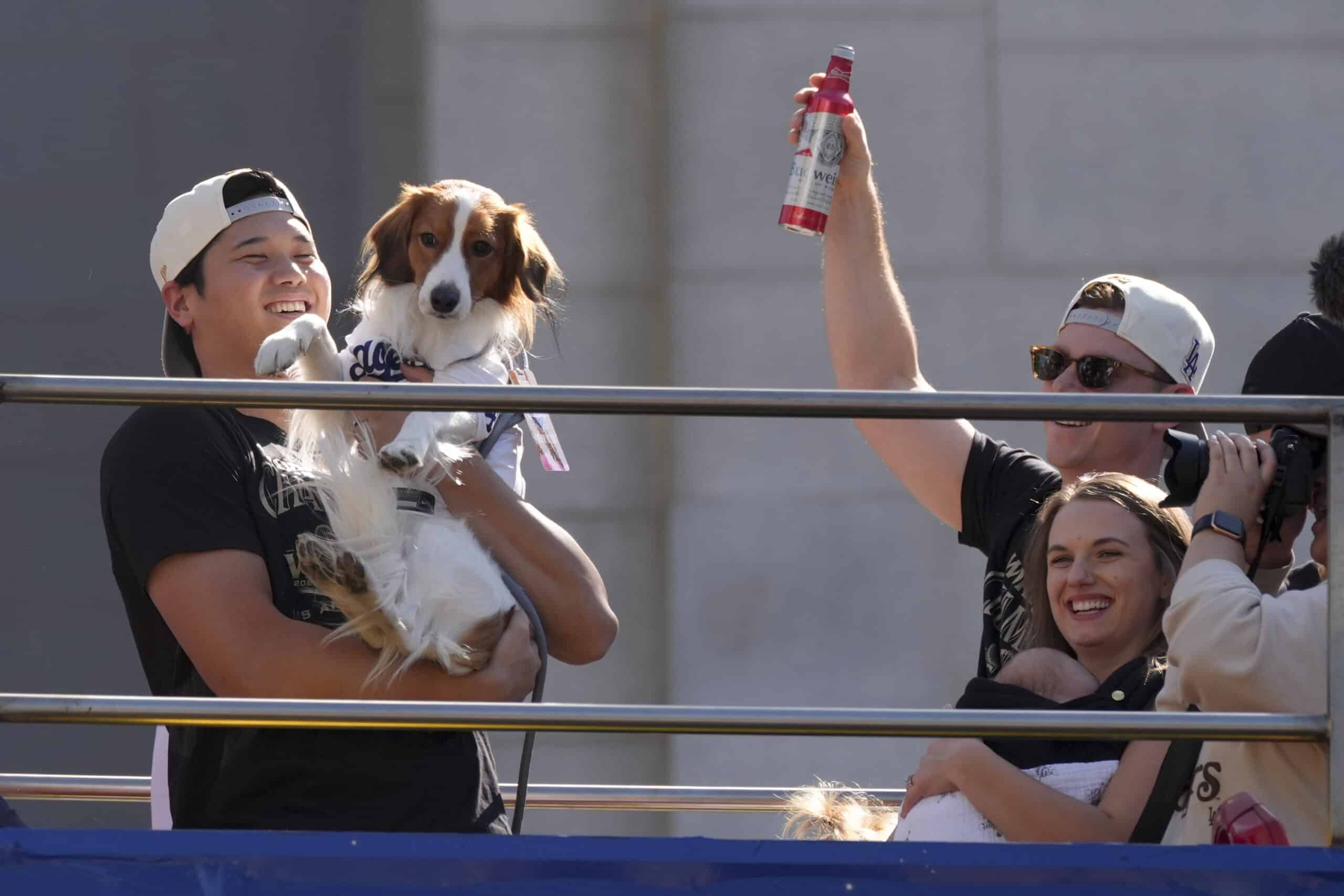 Los Angeles Dodgers' Shohei Ohtani holds his dog Decoy World Series