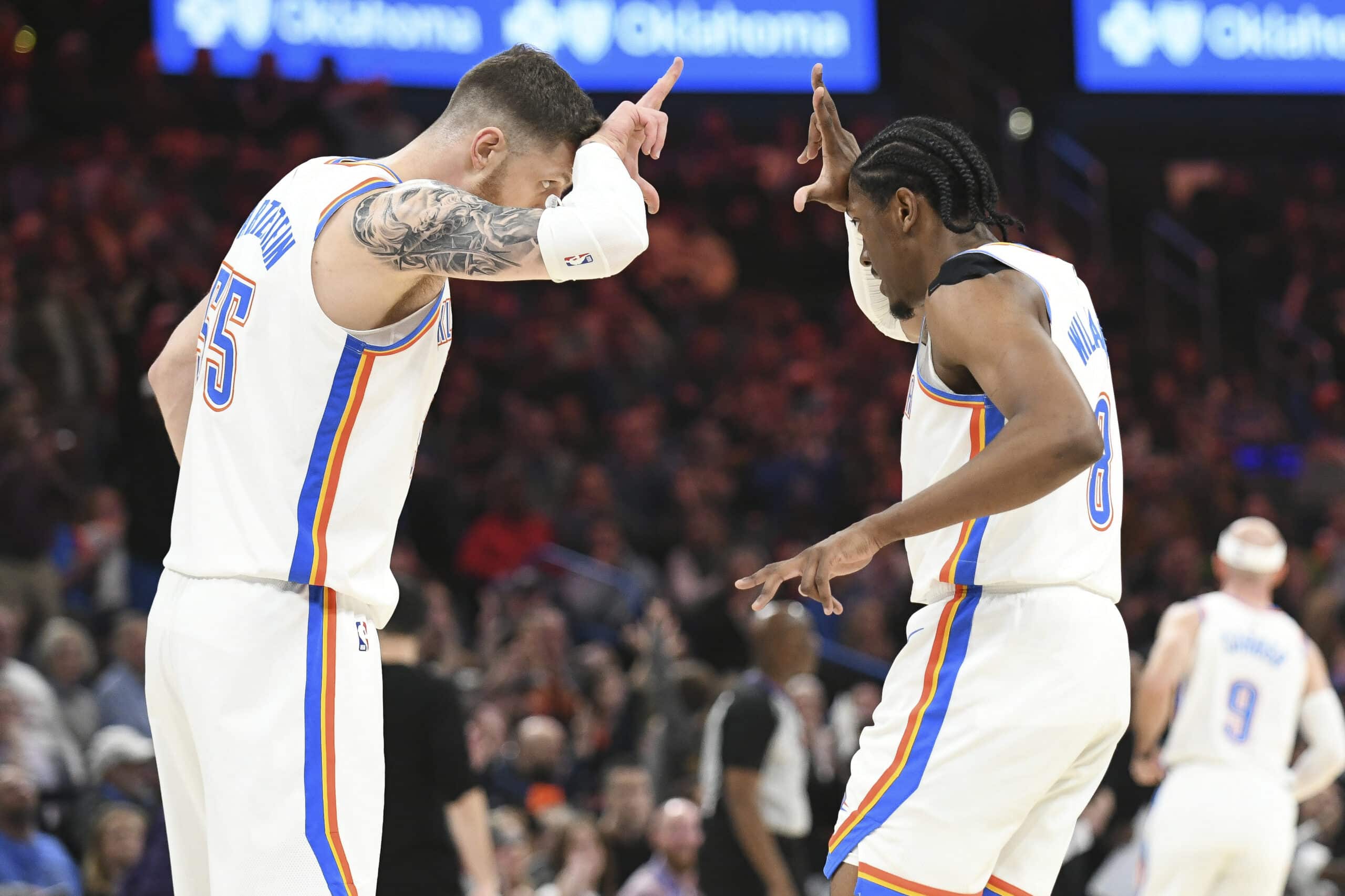 Oklahoma City Thunder center Isaiah Hartenstein, left, celebrates with forward Jalen Williams,  NBA