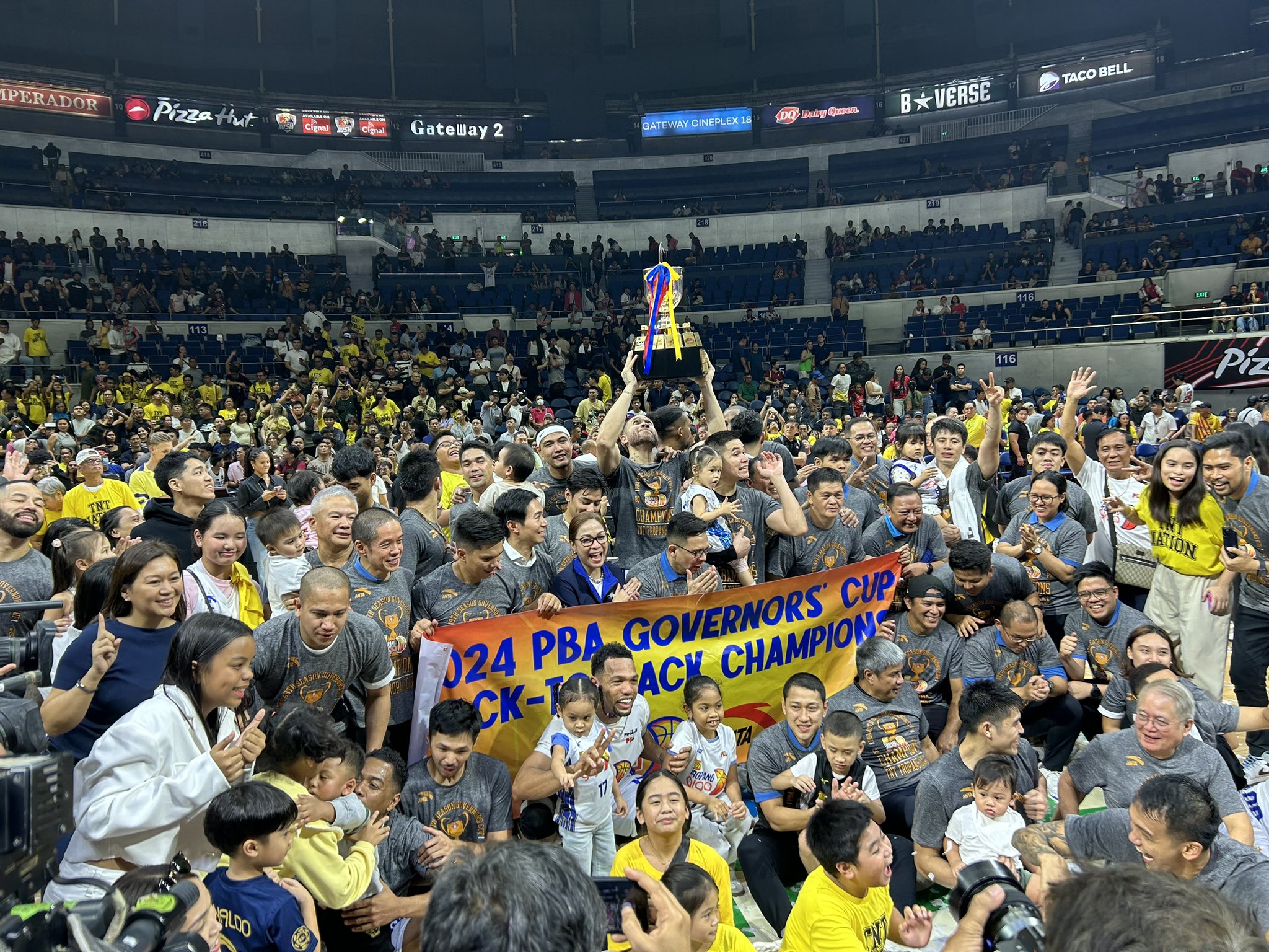 TNT Tropang Giga raise their PBA Governors' Cup trophy after beating Barangay Ginebra anew. 