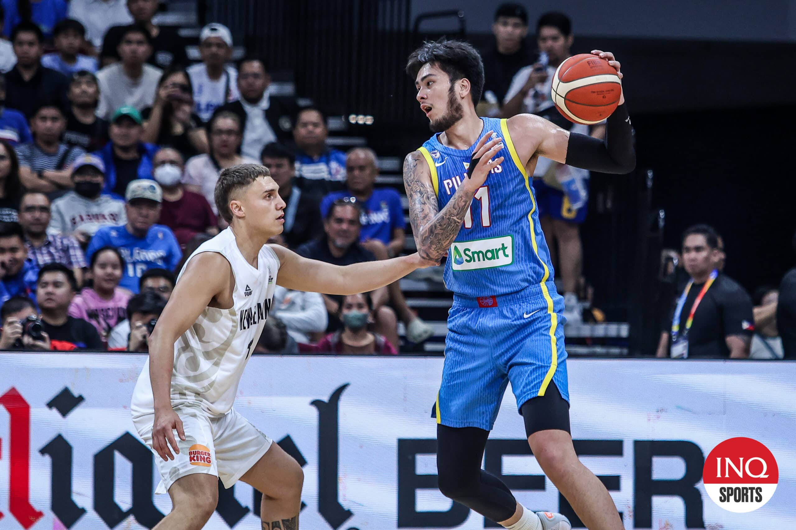 Gilas Pilipinas center Kai Sotto against a New Zealand defender in a Fiba Asia Cup 2025 Qualifiers game at Mall of Asia Arena.