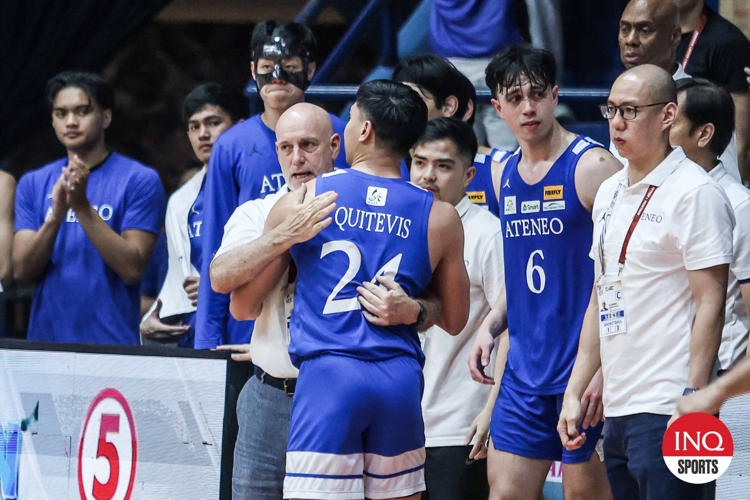 Ateneo Blue Eagles' graduating player Sean Quitevis hugs coach Tab Baldwin  after their final elimination round game in the UAAP Season 87 men's basketball game