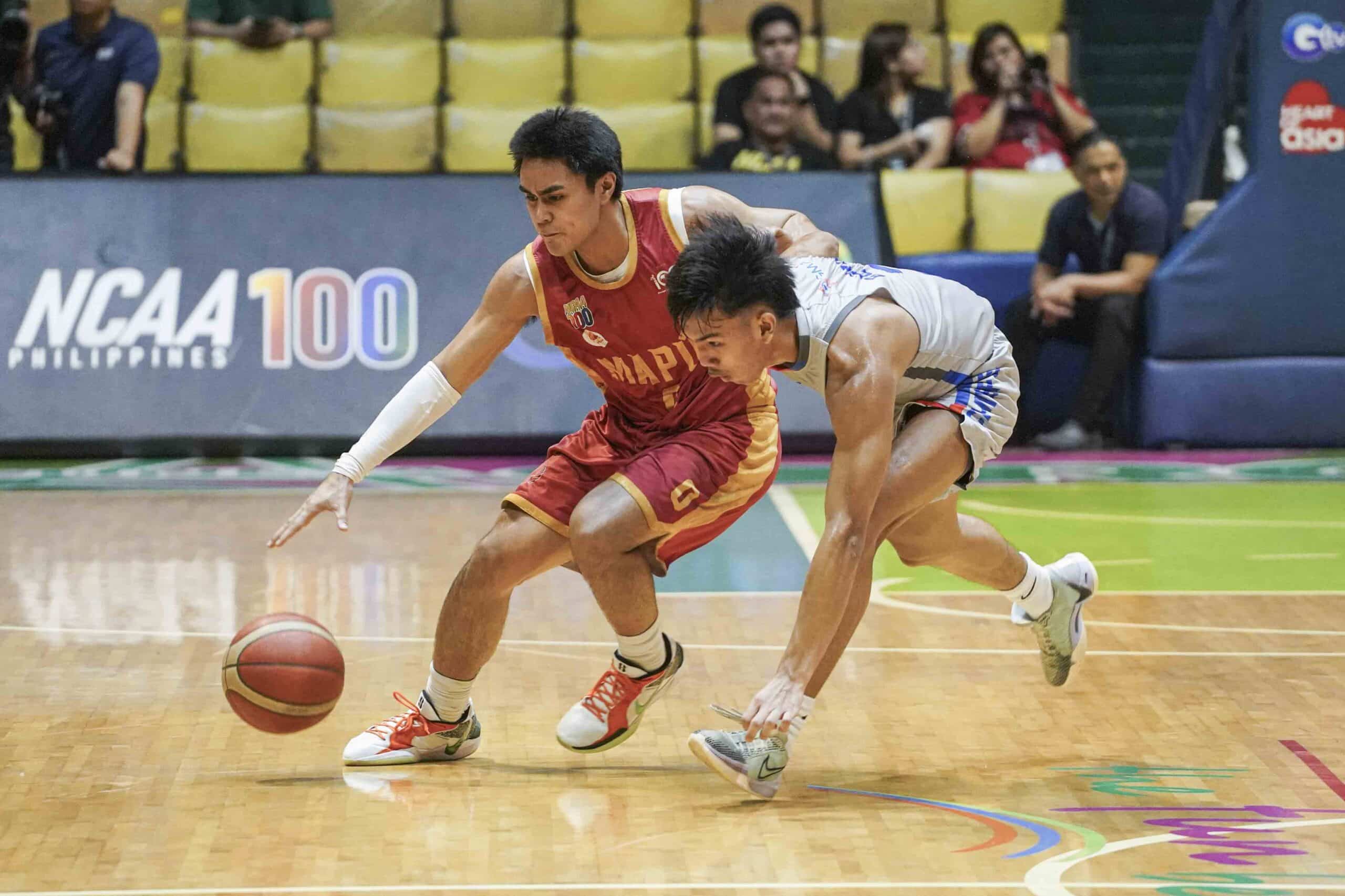 Mapua’s Clint Escamis (left) dribbles around Arellano’sAnthony Borromeo. 