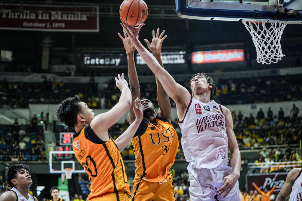 Quentin Millora-Brown (right) plucks down 19 rebounds for the Finals-bound Maroons, where he has a shot at a UAAP crown in a one-and-done season.