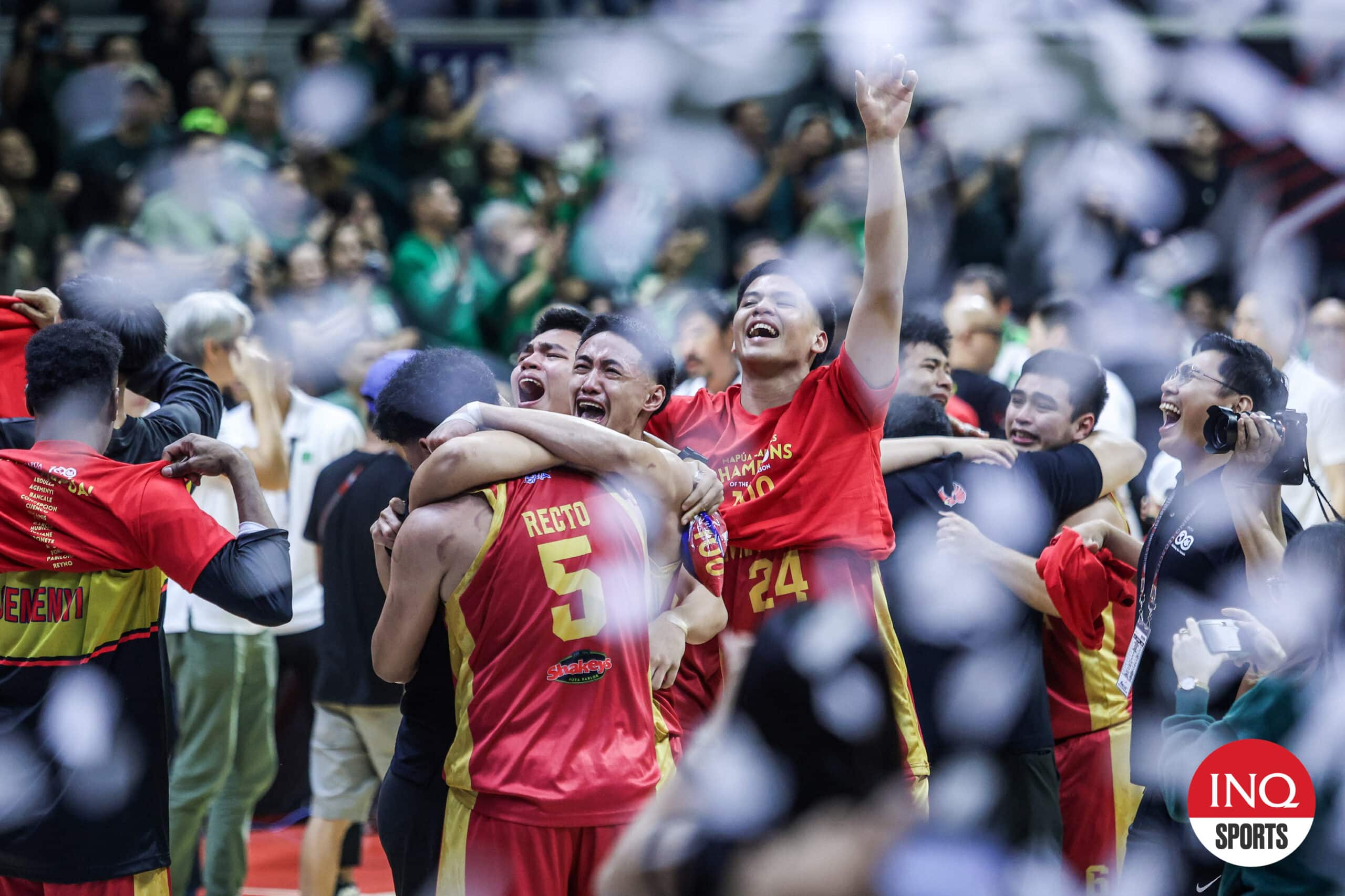 Mapua Cardinals celebrate winning the NCAA Season 100 men's basketball tournament after beating Benilde Blazers in two games.