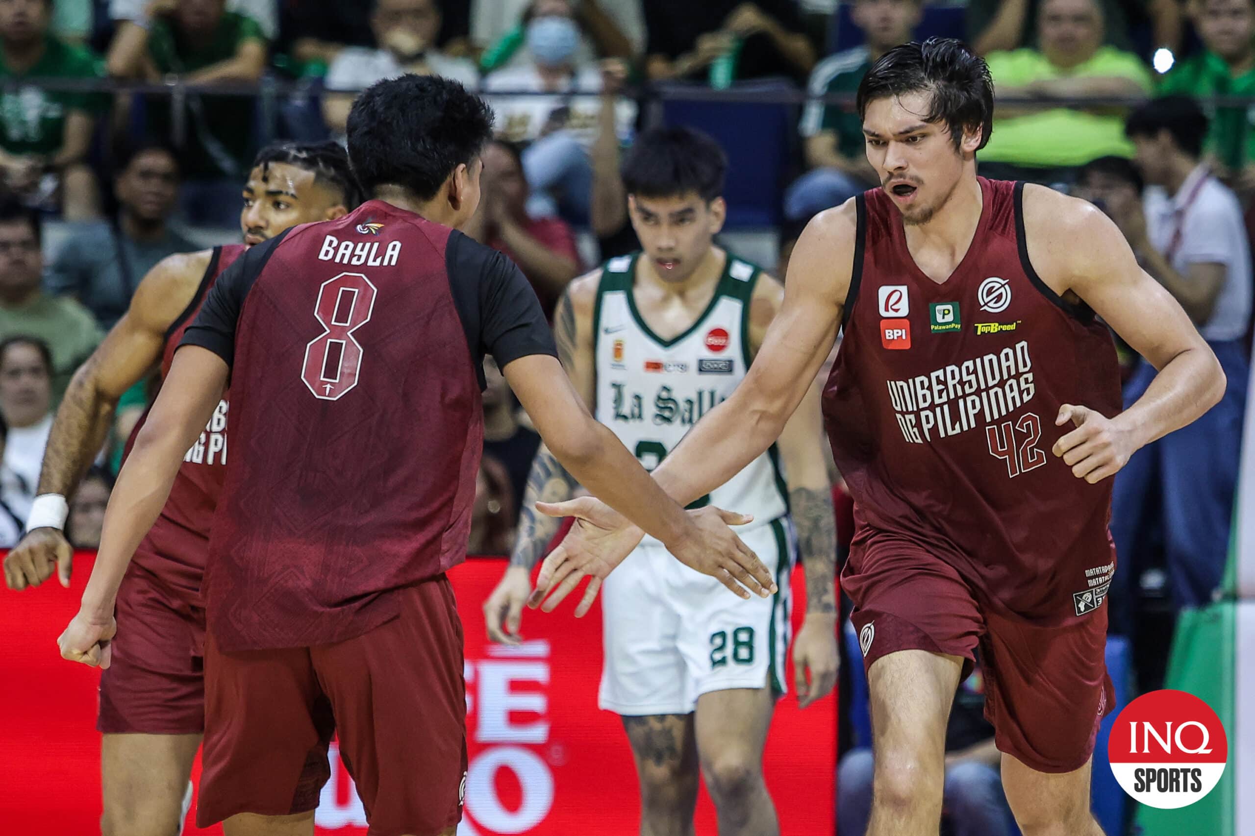 UP Fighting Maroons' Quentin Millora-Brown, Jacob Bayla and La Salle Green Archers' Kevin Quiambao during Game 1 of the UAAP Season 87 men's basketball finals