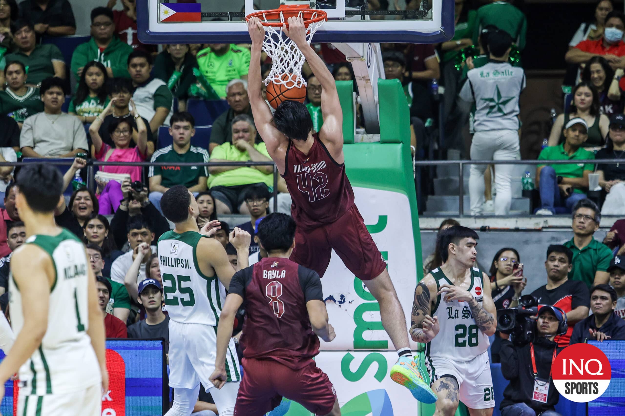 Quentin Millora-Brown rises for a slam in Game 1 of the UAAP Season 87 men's basketball Finals between La Salle Green Archers and UP Fighting Maroons.