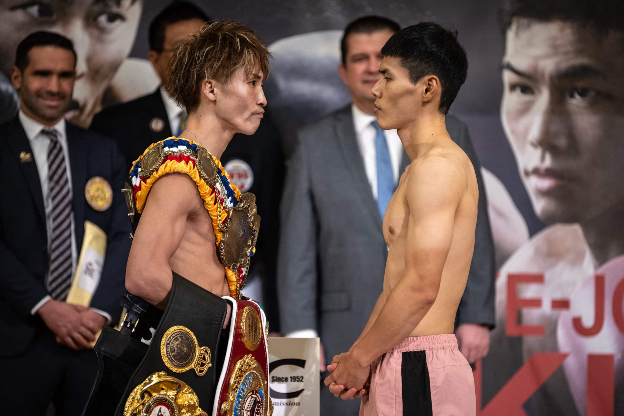 Naoye Inoue centered on Korean with lights of Vegas on horizon