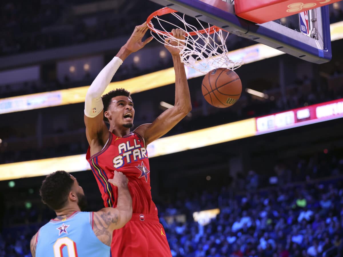 Team Chuck's Victor Wembanyama dunks against Team Shaq's Damian Lillard during the championship game of the 74th NBA All-Star Game in San Francisco, Sunday, Feb. 16, 2025.