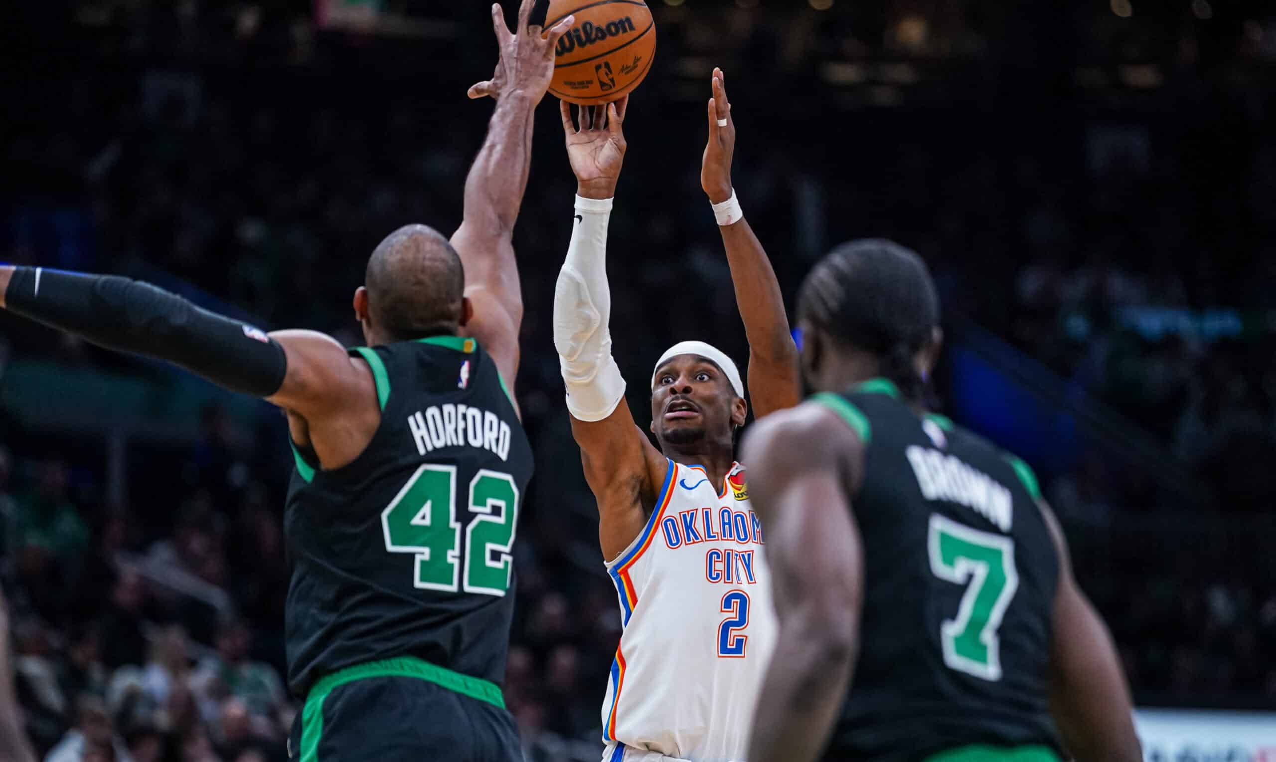 NBA Mar 12, 2025; Boston, Massachusetts, USA; Oklahoma City Thunder guard Shai Gilgeous-Alexander (2) shoots the ball against Boston Celtics center Al Horford (42) in the third quarter at TD Garden