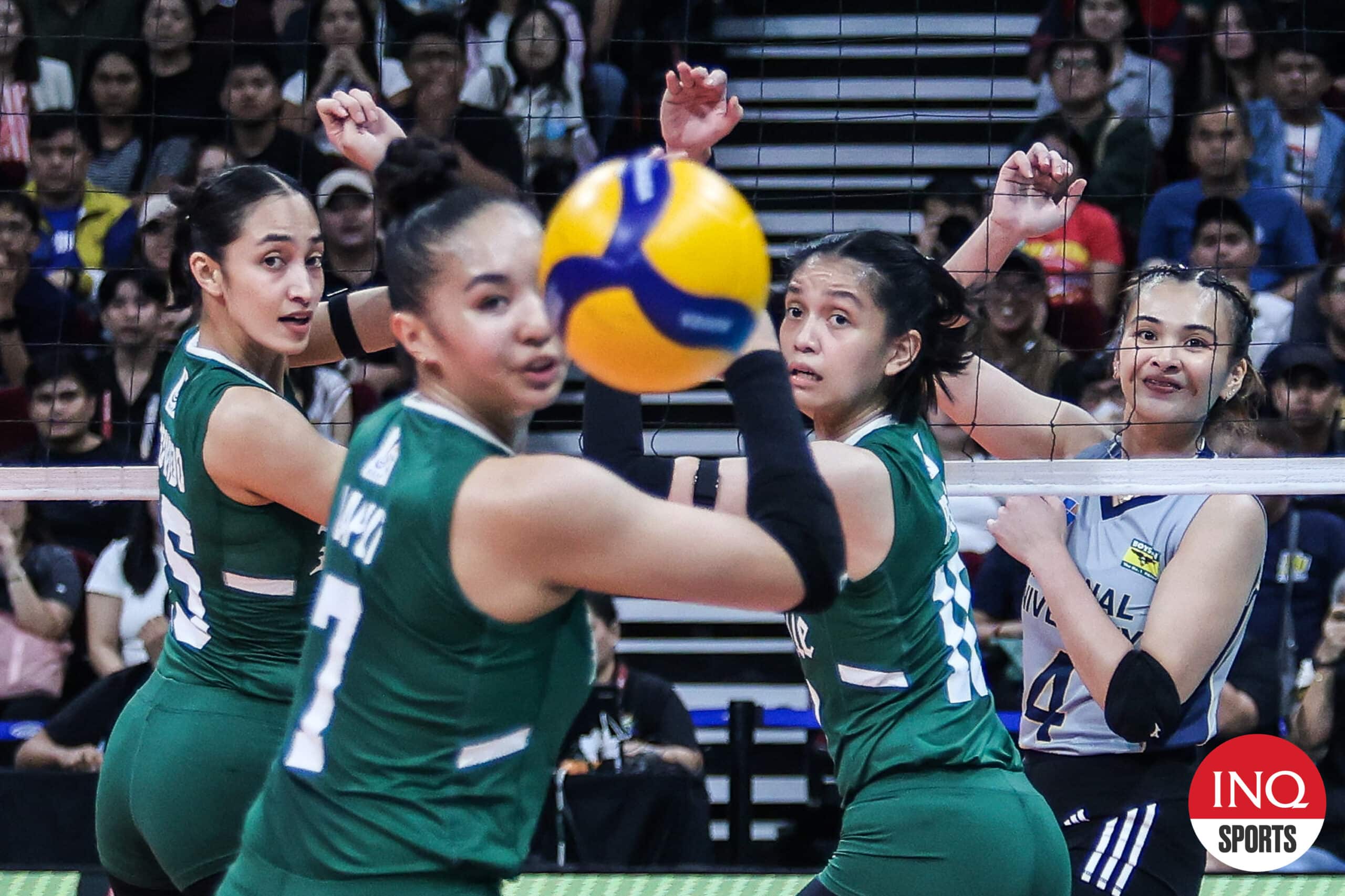 NU Lady Bulldogs' Bella Belen and La Salle Lady Spikers' Shevana Laput look on during a play in the UAAP Season 87 women's volleyball tournament.