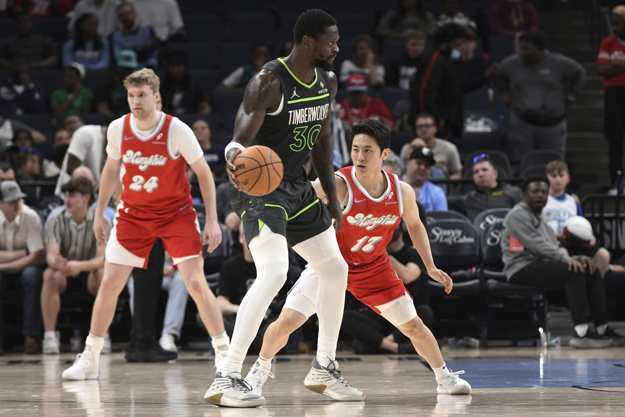 Memphis Grizzlies guard Yuki Kawamura (17) defends Minnesota Timberwolves forward Julius Randle (30) in the second half of an NBA basketball game Thursday, April 10, 2025, in Memphis, Tennessee.