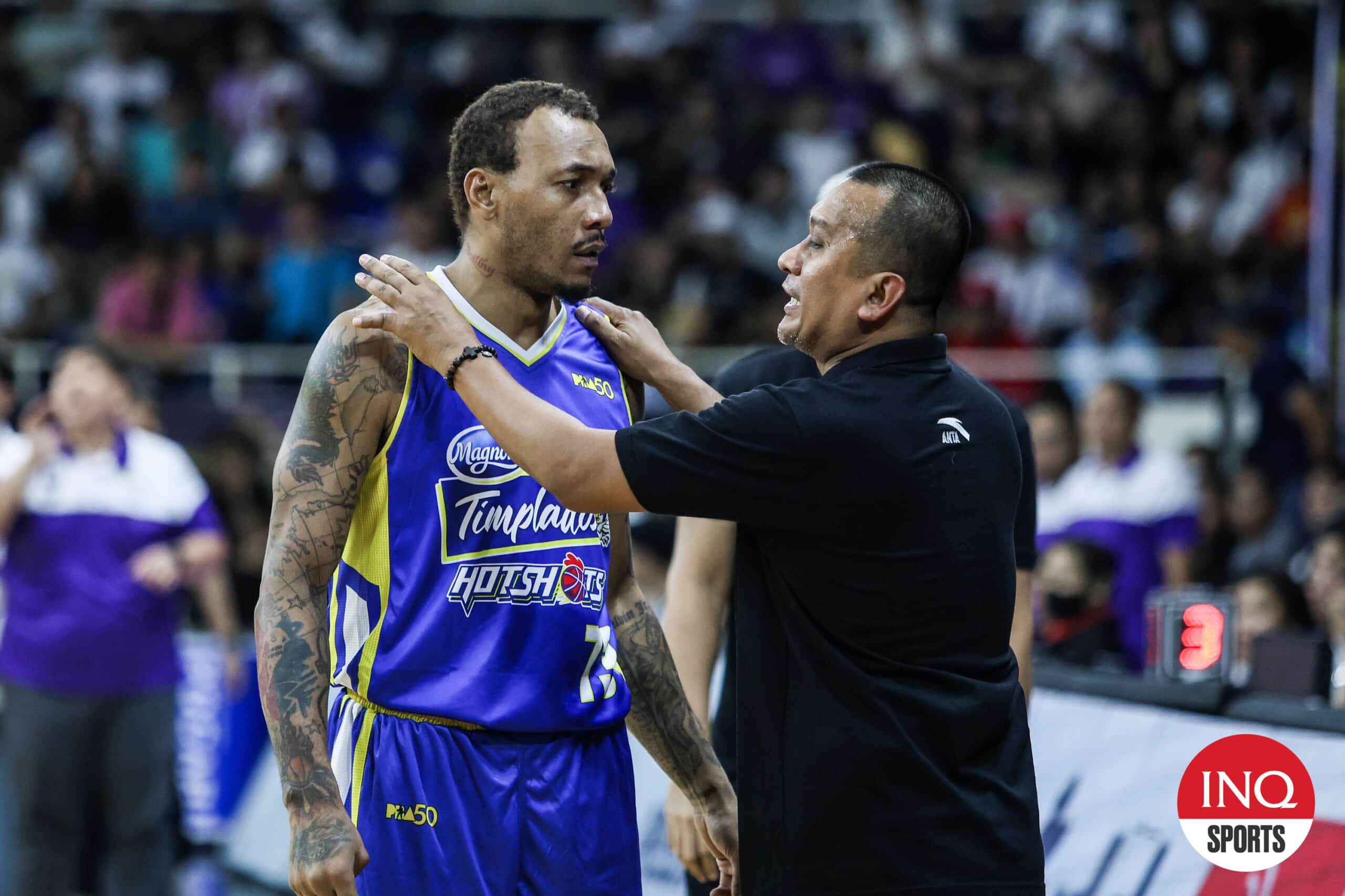 Magnolia Hotshots' Calvin Abueva with coach Chito Victolero during the PBA's 50th anniversary game at Rizal Memorial Coliseum.