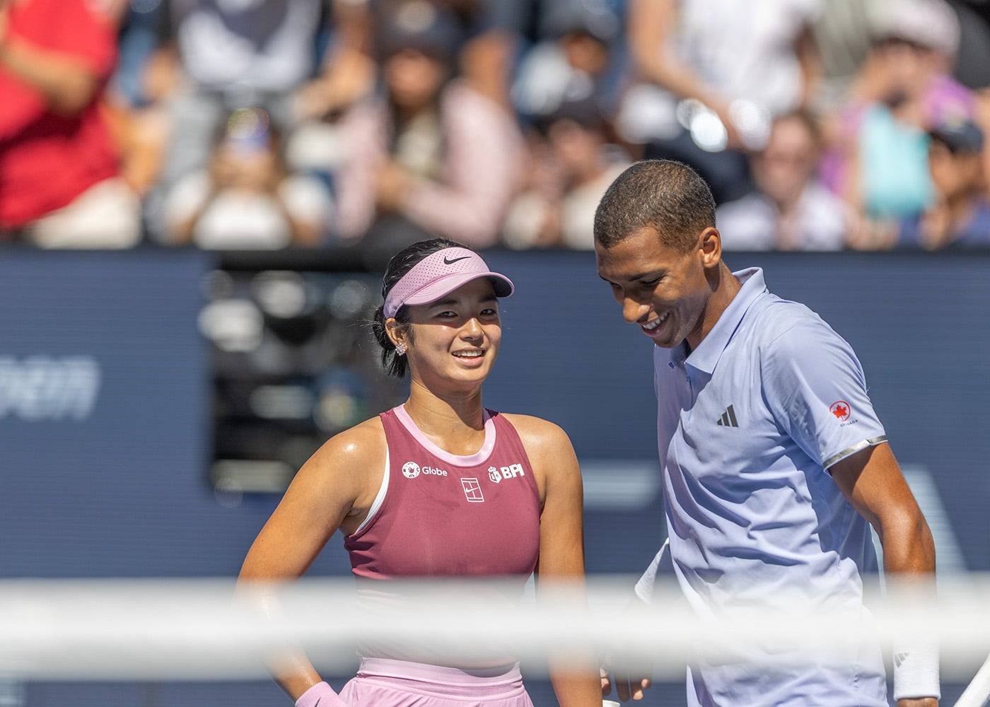 Crowd favorites Alex Eala(left) and Felix Auger-Aliassime discuss strategy before the start of a point. 