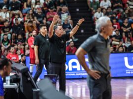 Ginebra coach Tim Cone and TNT coach Chot Reyes (foreground) during a PBA Philippine CUp game.