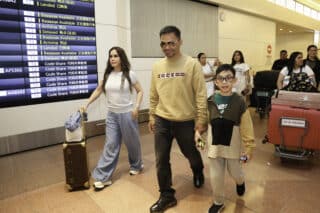 Manny Pacquiao arrives in Japan with his family ahead of his exhibition fight set for Sunday.