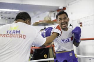 Manny Pacquiao goes through a training session with Buboy Fernandez at Kyokuto Gym in Tokyo, Japan.