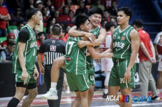 St. Benilde Blazers celebrate their win over San Beda Red Lions in the NCAA Season 100 men's basketball tournament.